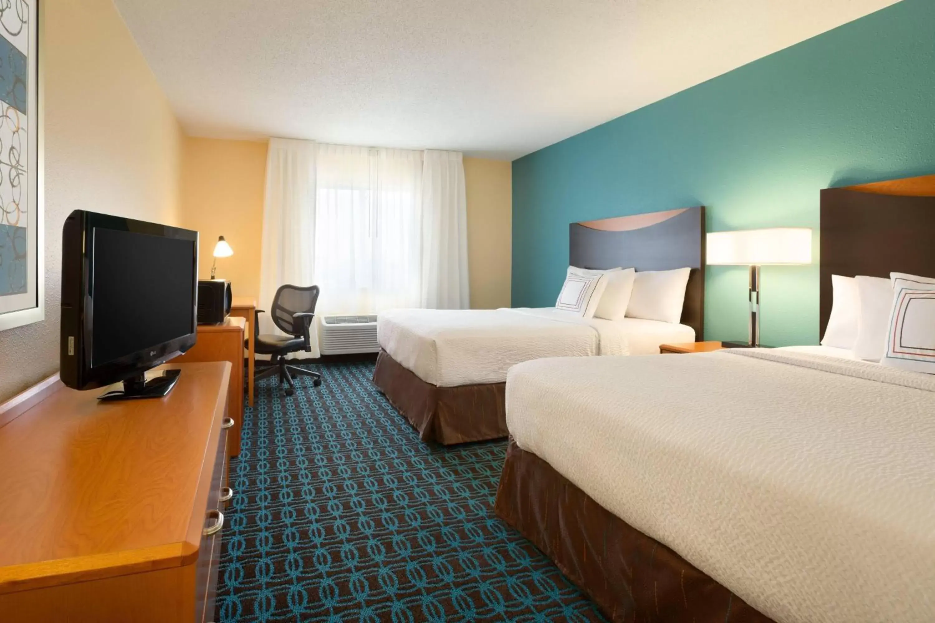 Photo of the whole room, TV/Entertainment Center in Fairfield Inn & Suites Bismarck South