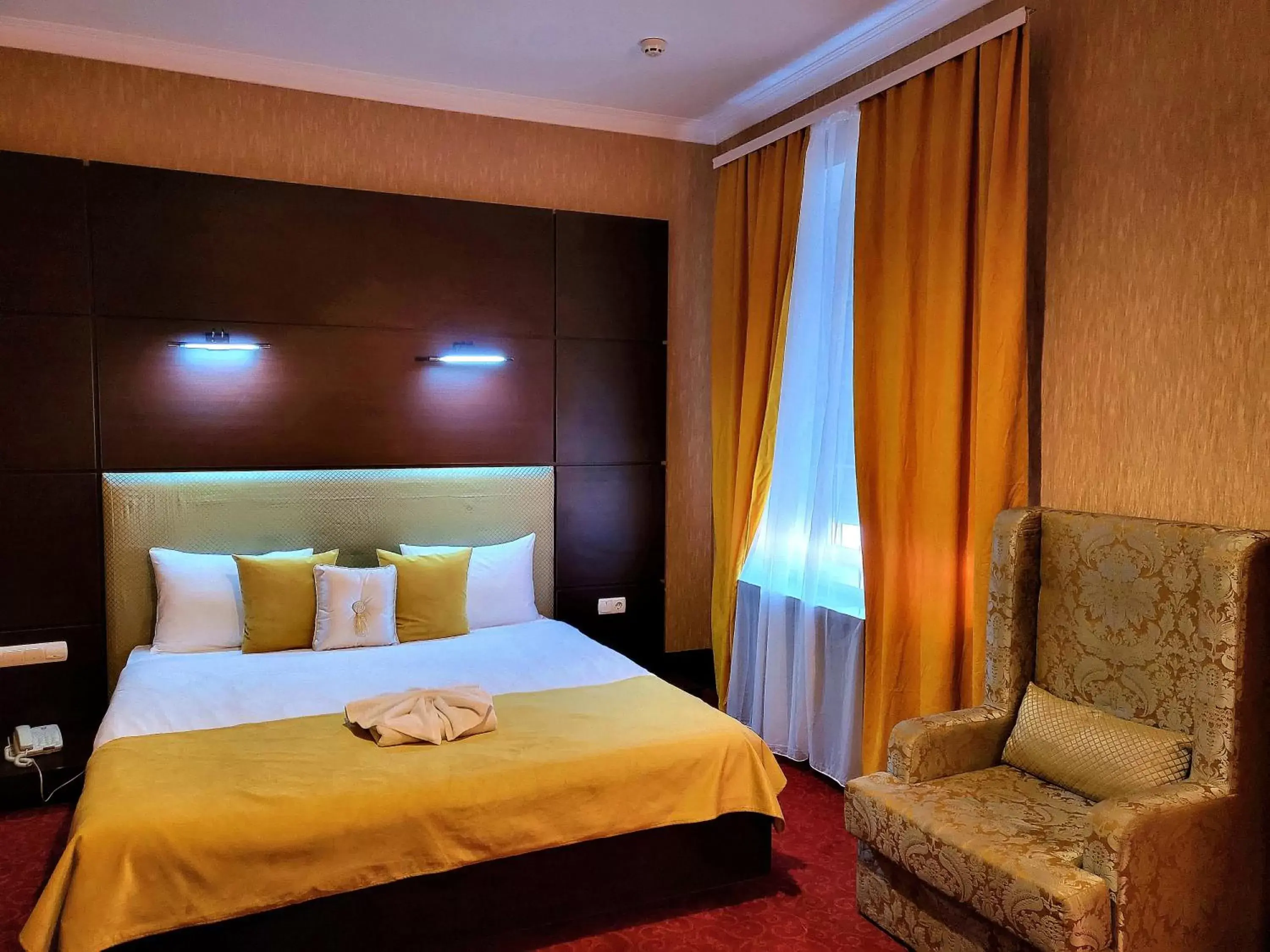 Bed in Maxim Pasha Hotel