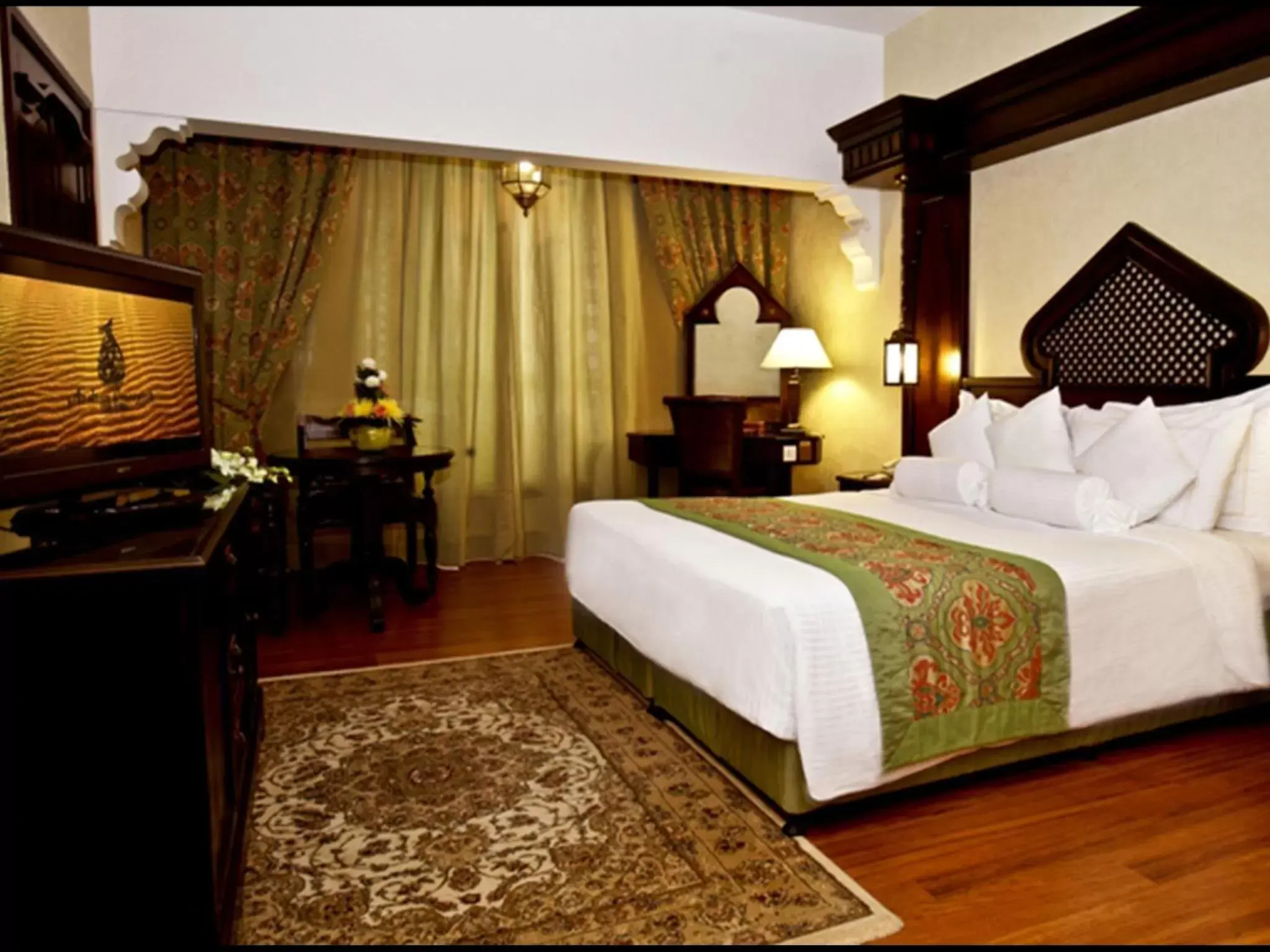 Living room, Bed in Arabian Courtyard Hotel & Spa
