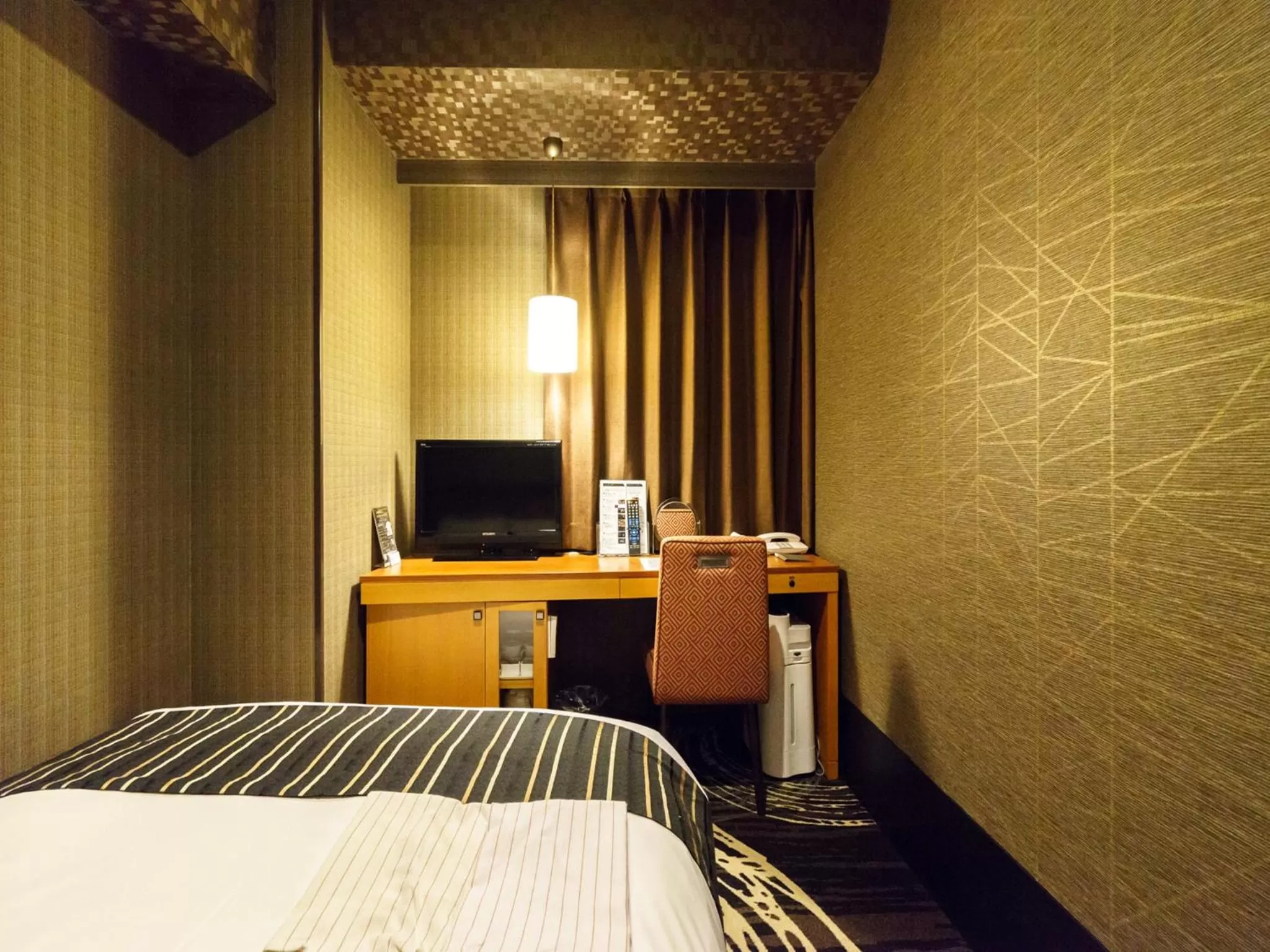 Bed in Sotetsu Fresa Inn Higashi Shinjuku