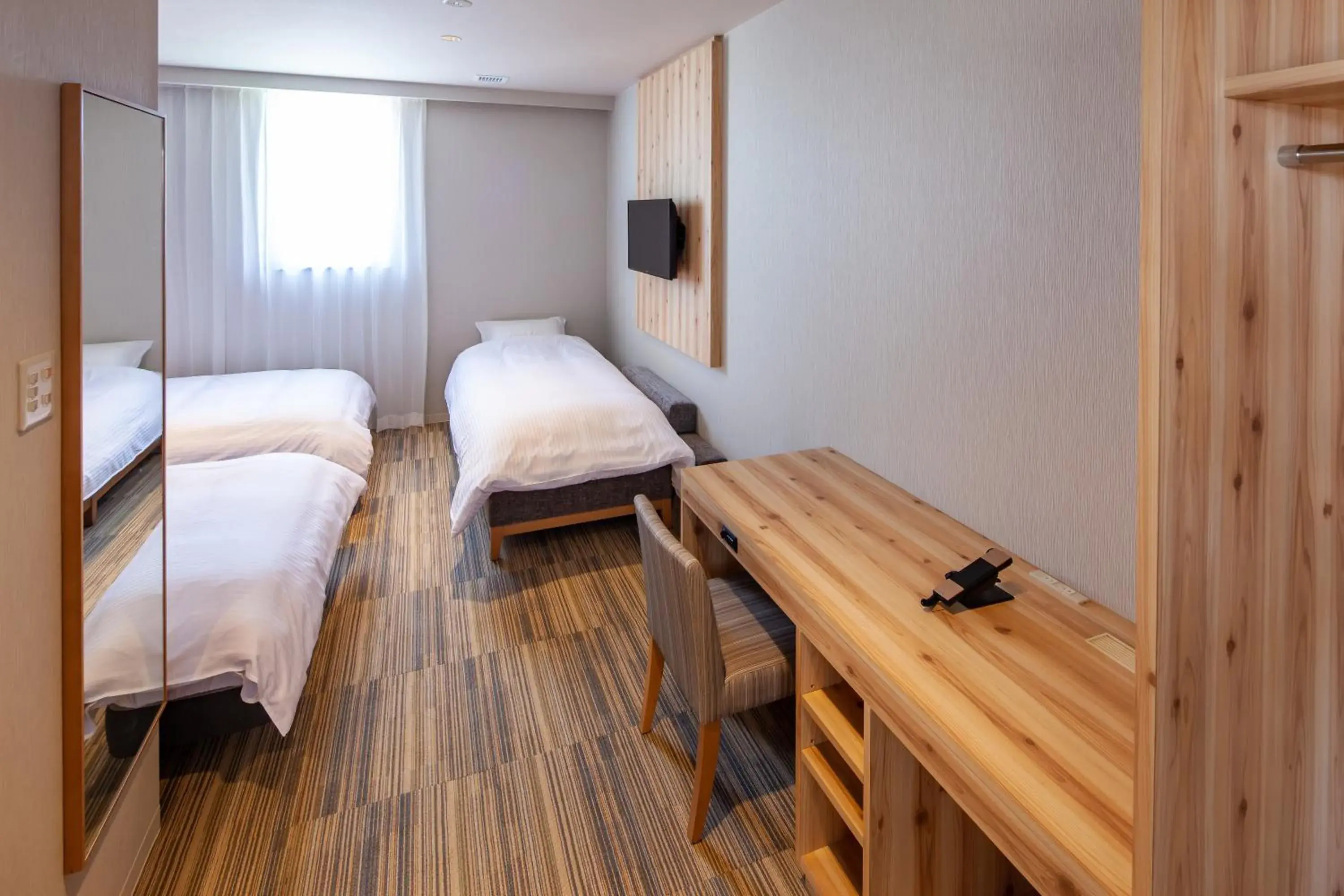 Photo of the whole room, Bed in Y's CABIN&HOTEL Naha Kokusai Street