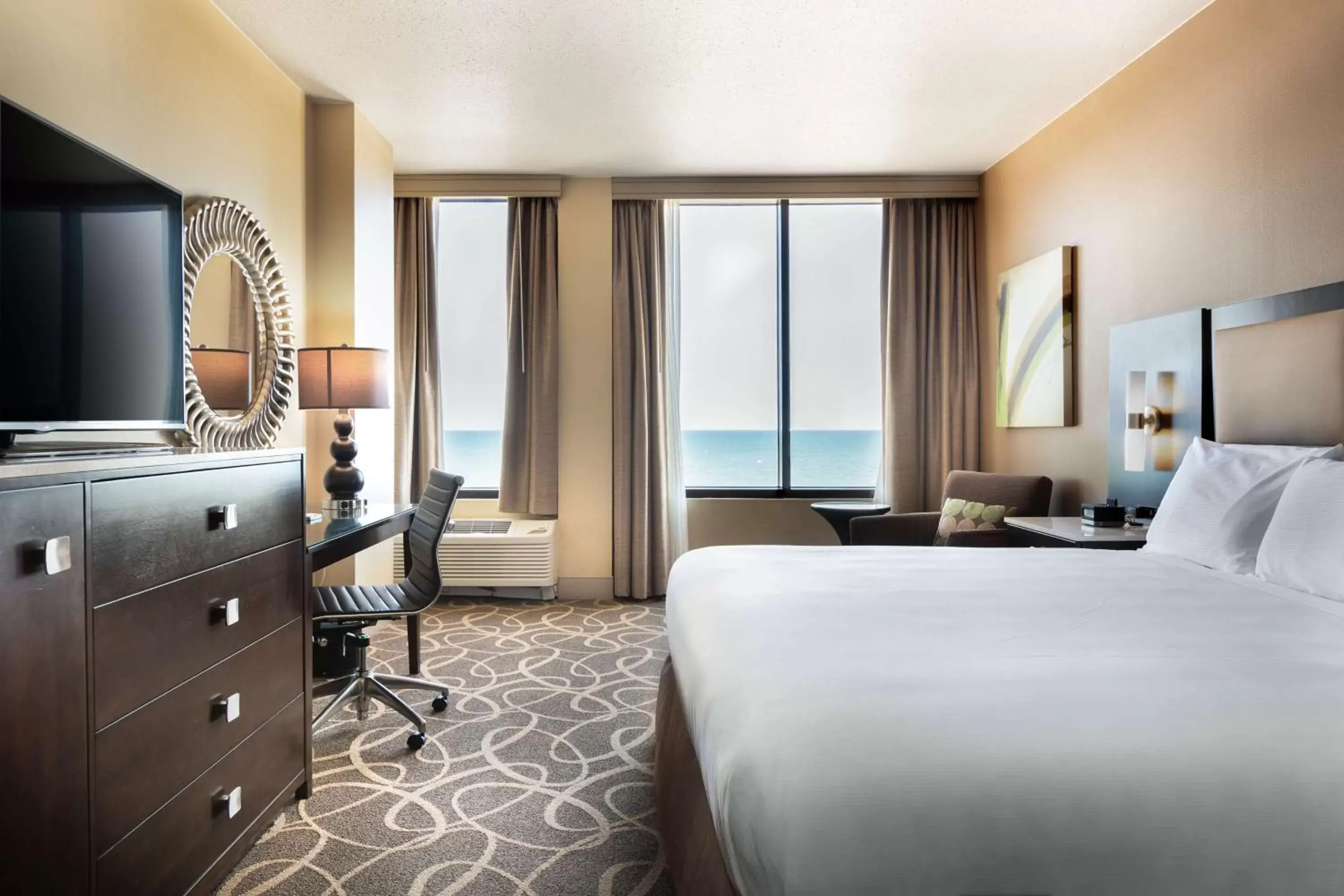 Bed, TV/Entertainment Center in Hilton Galveston Island Resort