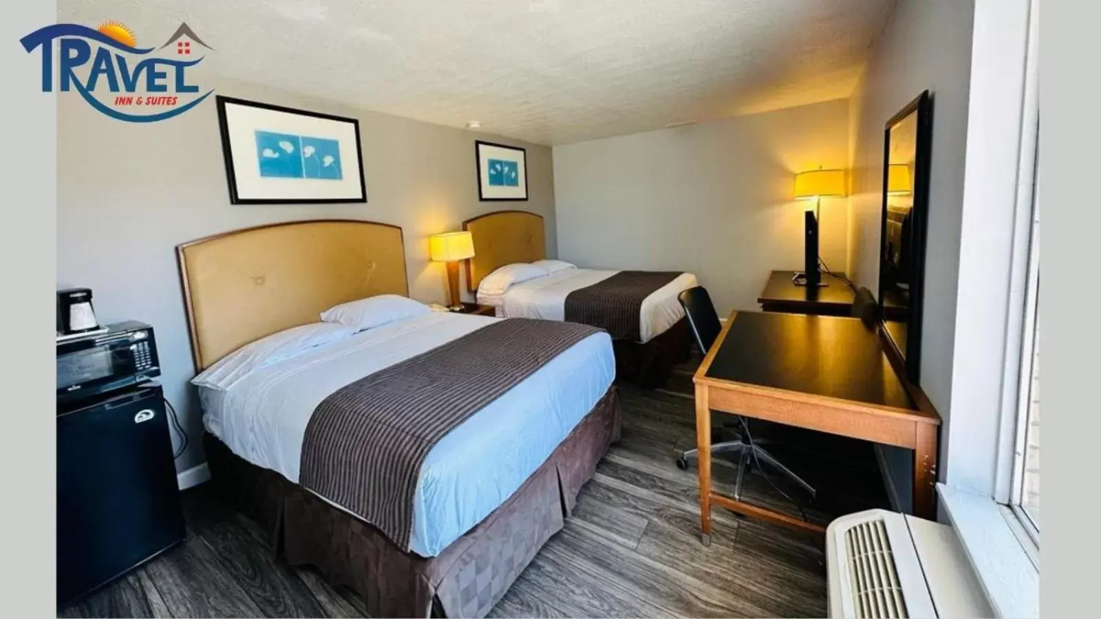 Bed in Travel Inn & Suites