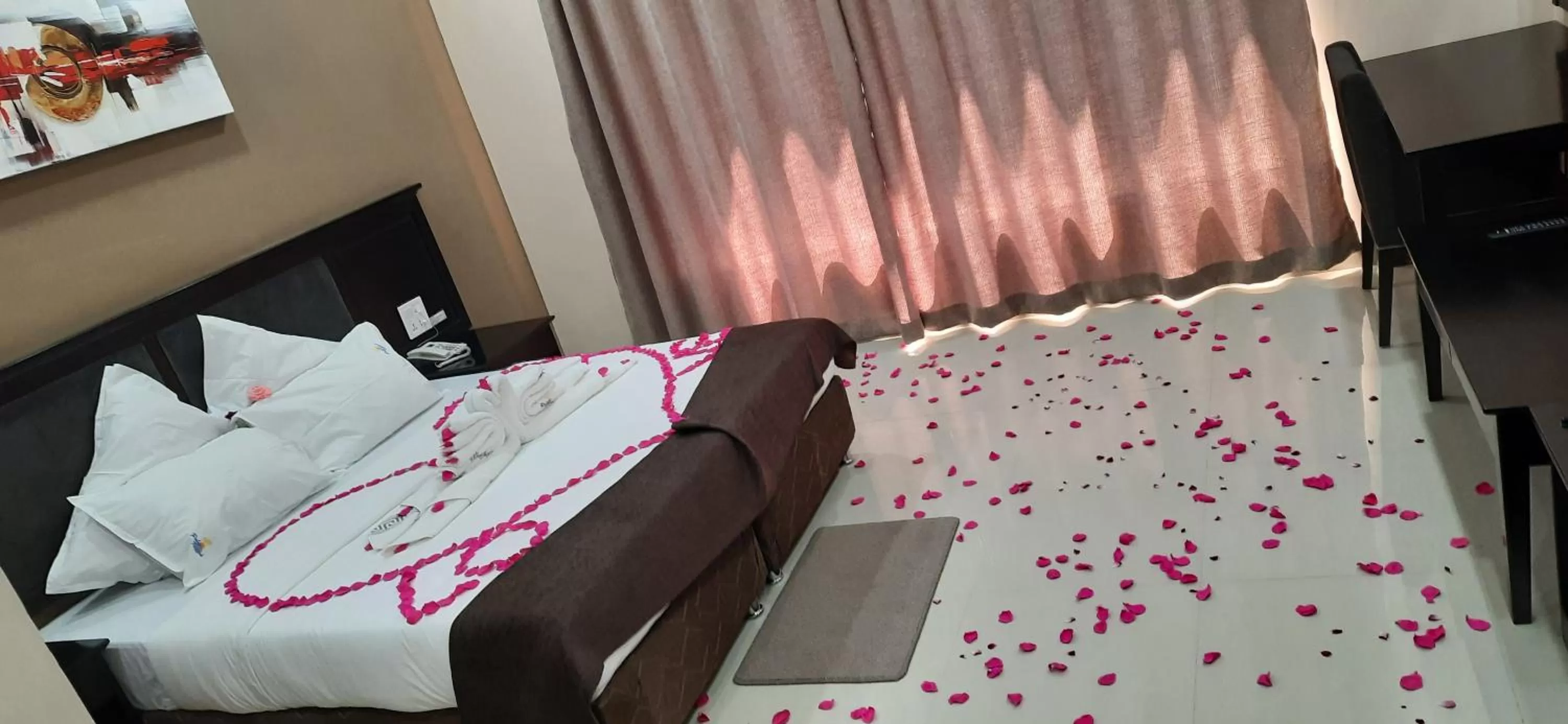 Bed in Palm Kalash Hotel