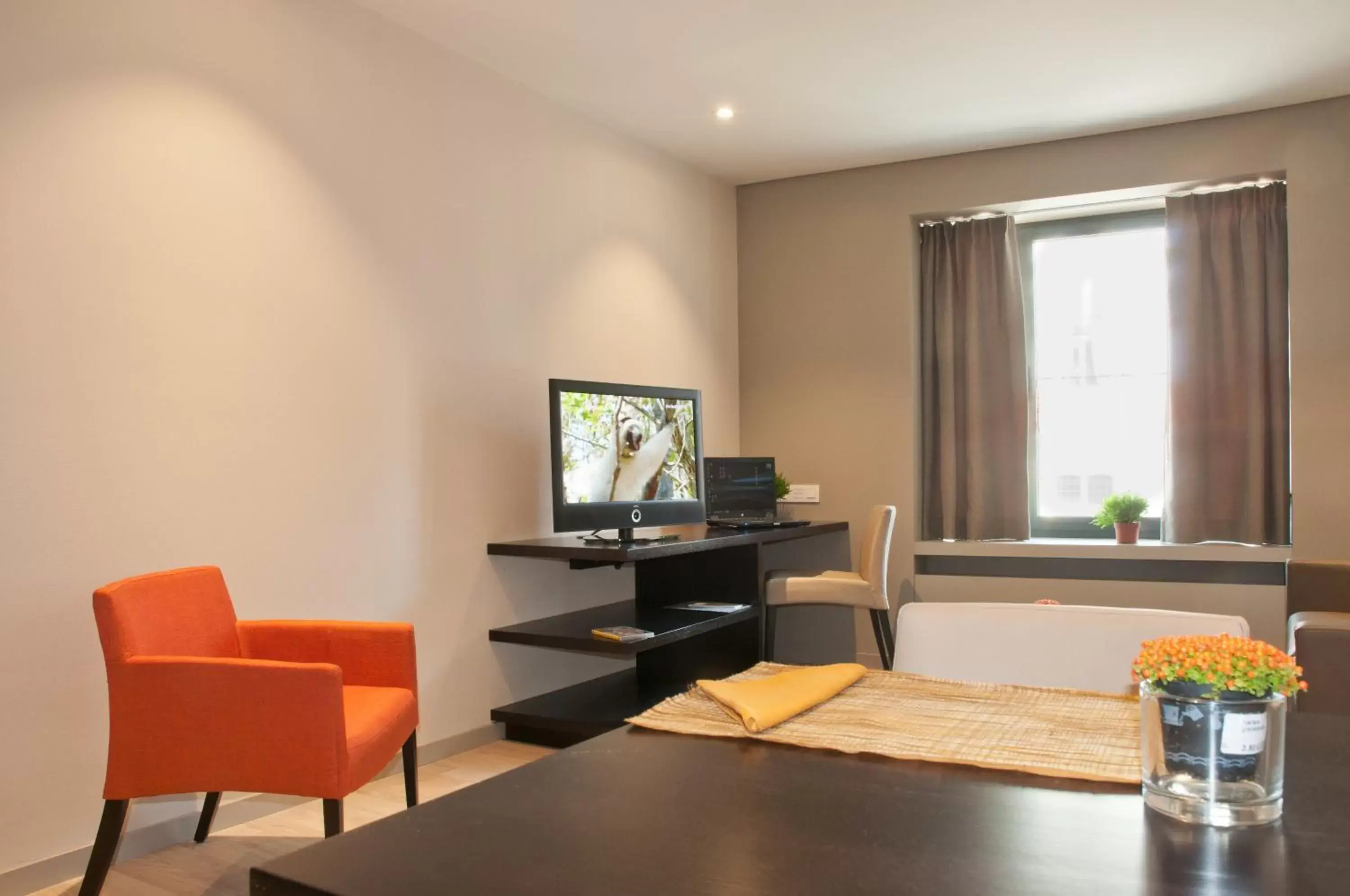 Seating area, TV/Entertainment Center in Castelnou Aparthotel