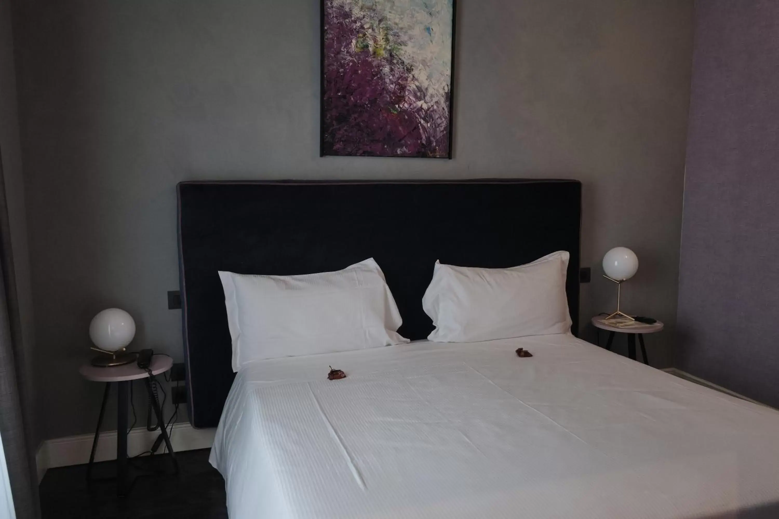 Bed in Capriccio Art Hotel