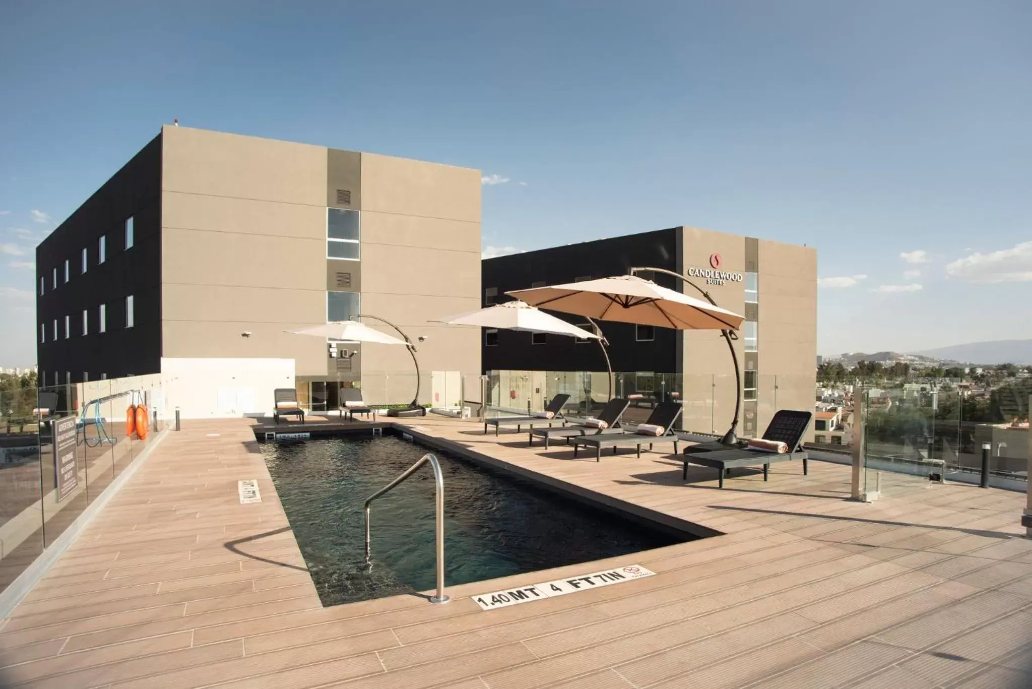 Swimming pool, Property Building in Candlewood Suites - Guadalajara Galerias, an IHG Hotel