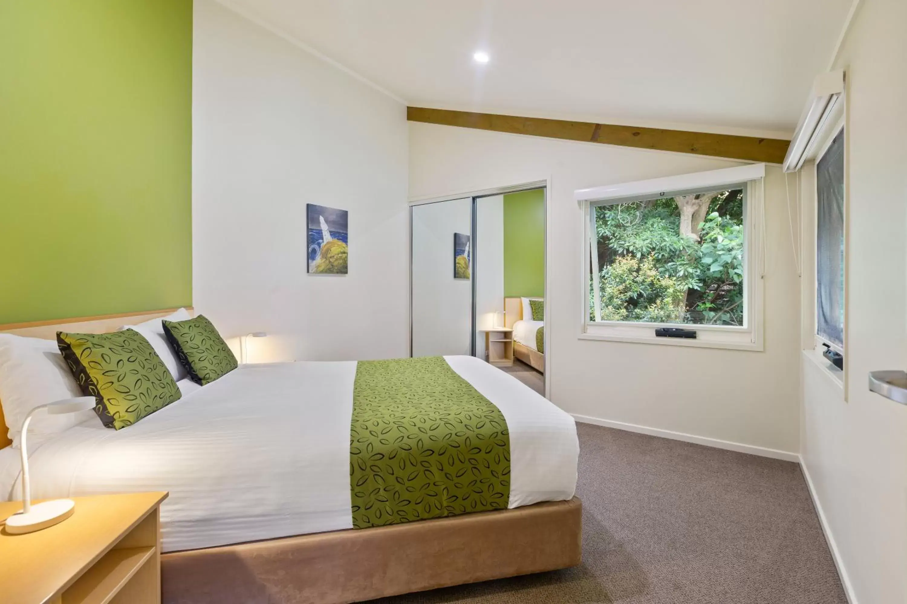 Bed in Tathra Beach House Holiday Apartments