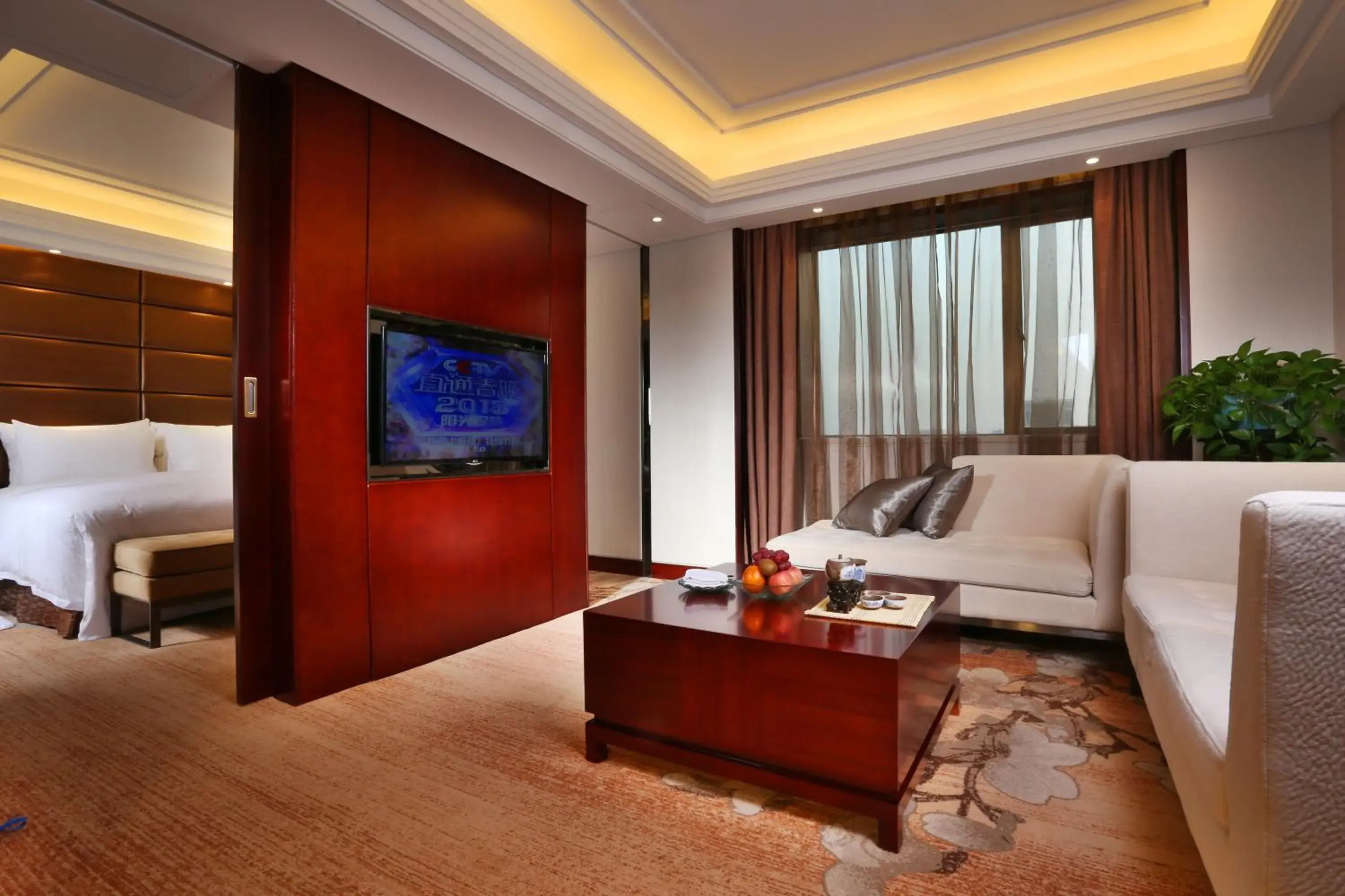 Living room, TV/Entertainment Center in GuangDong Hotel Shanghai