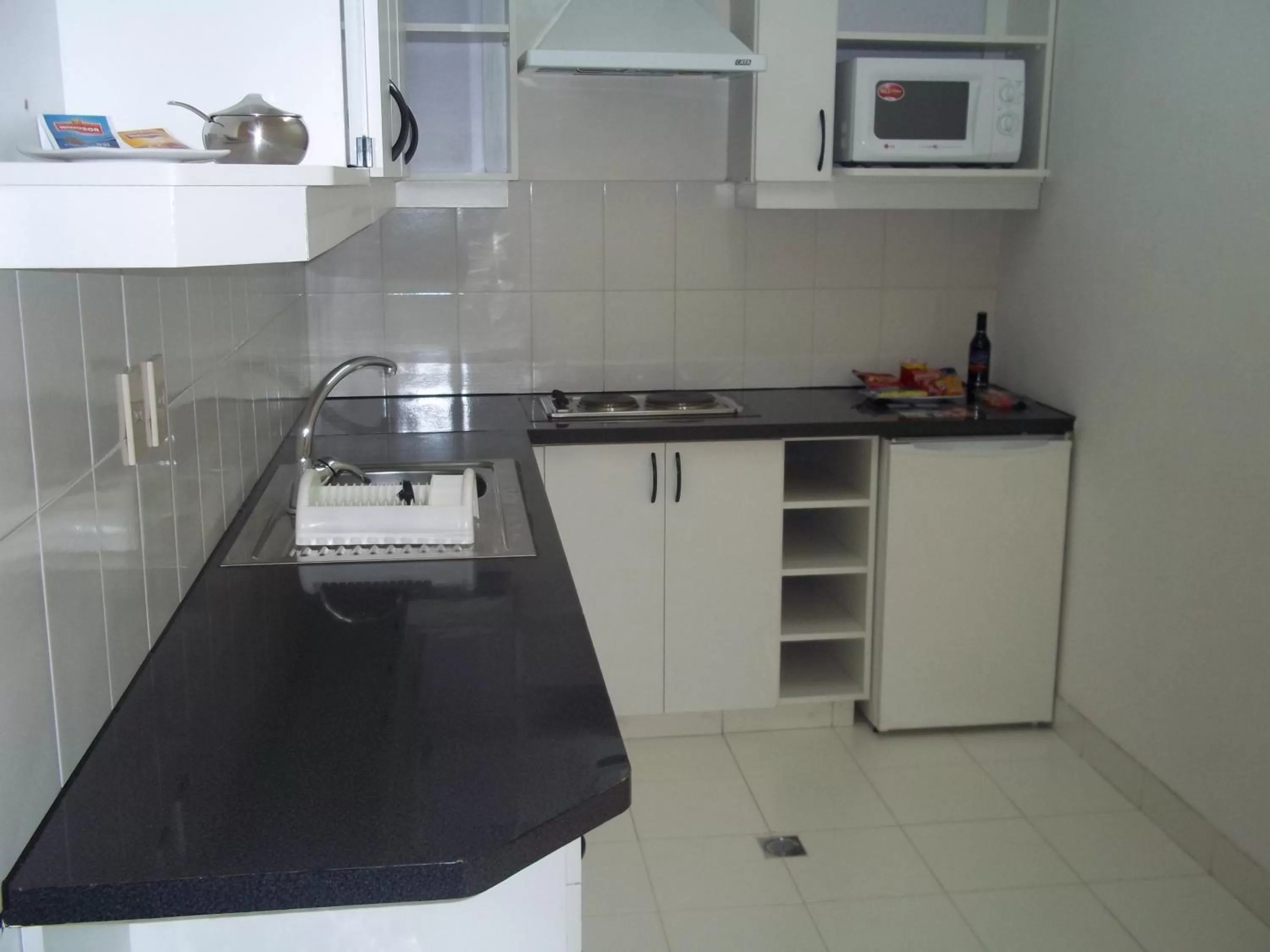 Kitchen or kitchenette in Delfines Apart Hotel