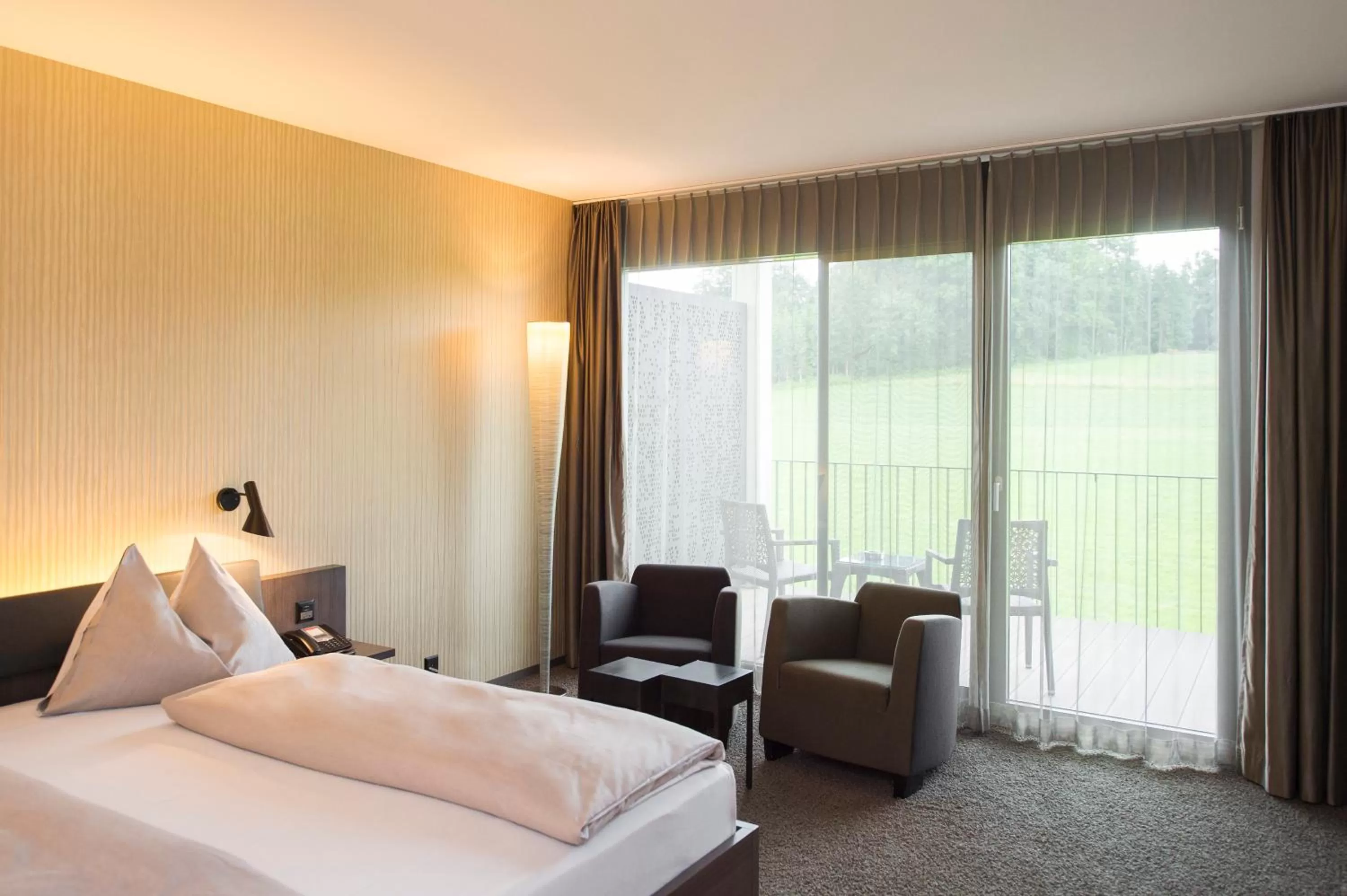 Photo of the whole room, Bed in Wellnesshotel Golfpanorama