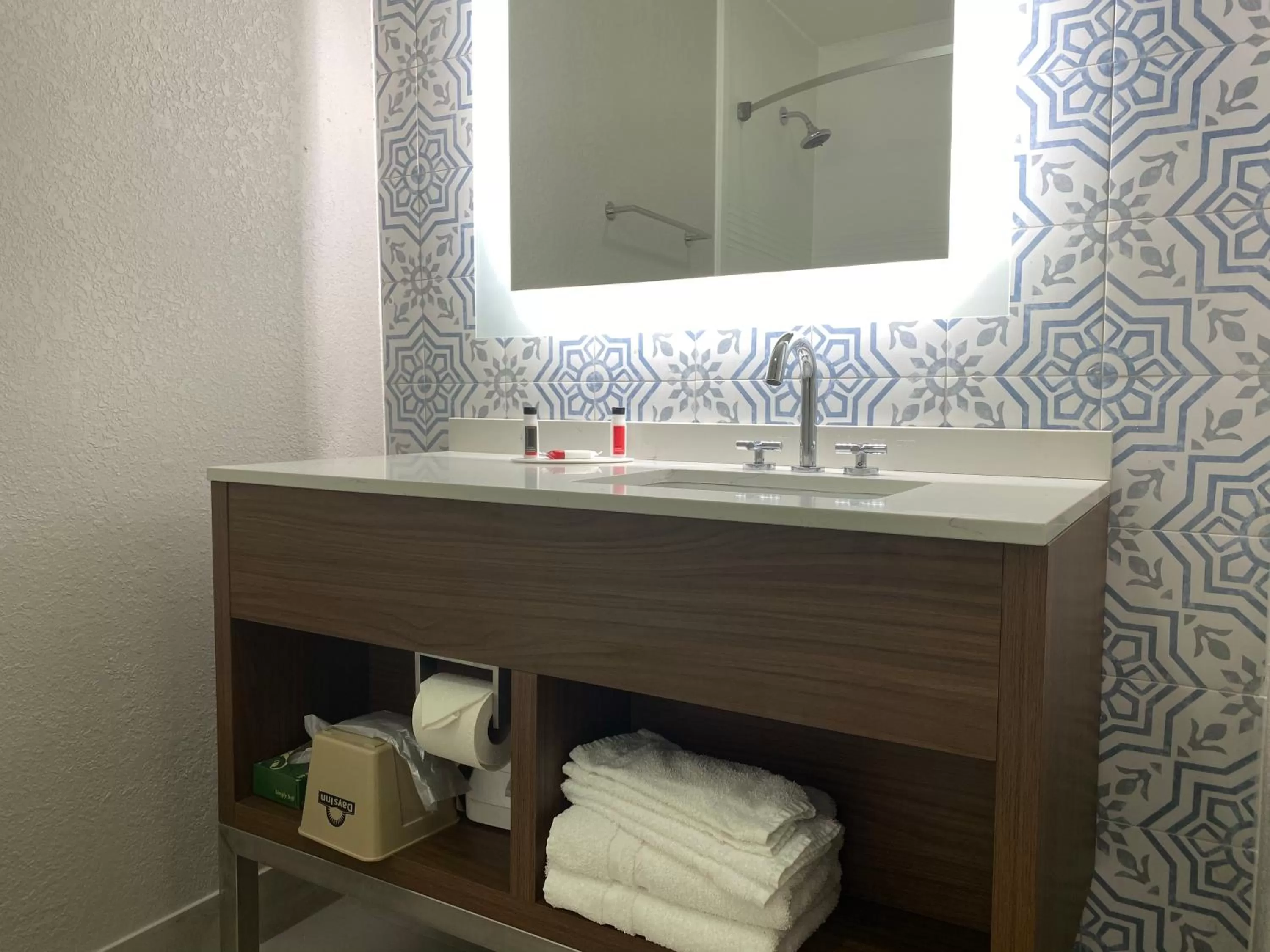 Bathroom in Days Inn & Suites by Wyndham Peachtree Corners Norcross