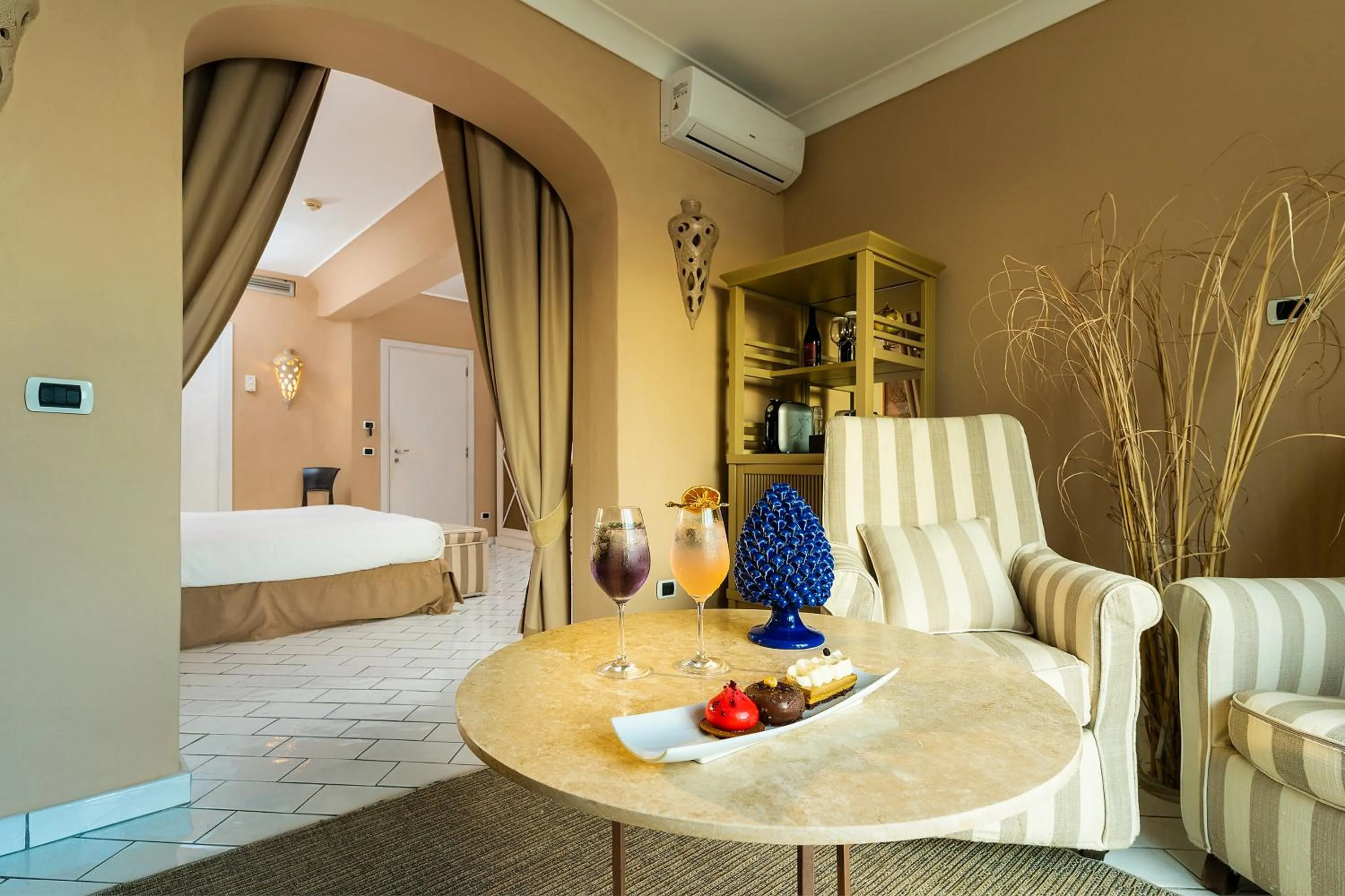 Living room, Bed in Therasia Resort Sea and SPA - The Leading Hotels of the World