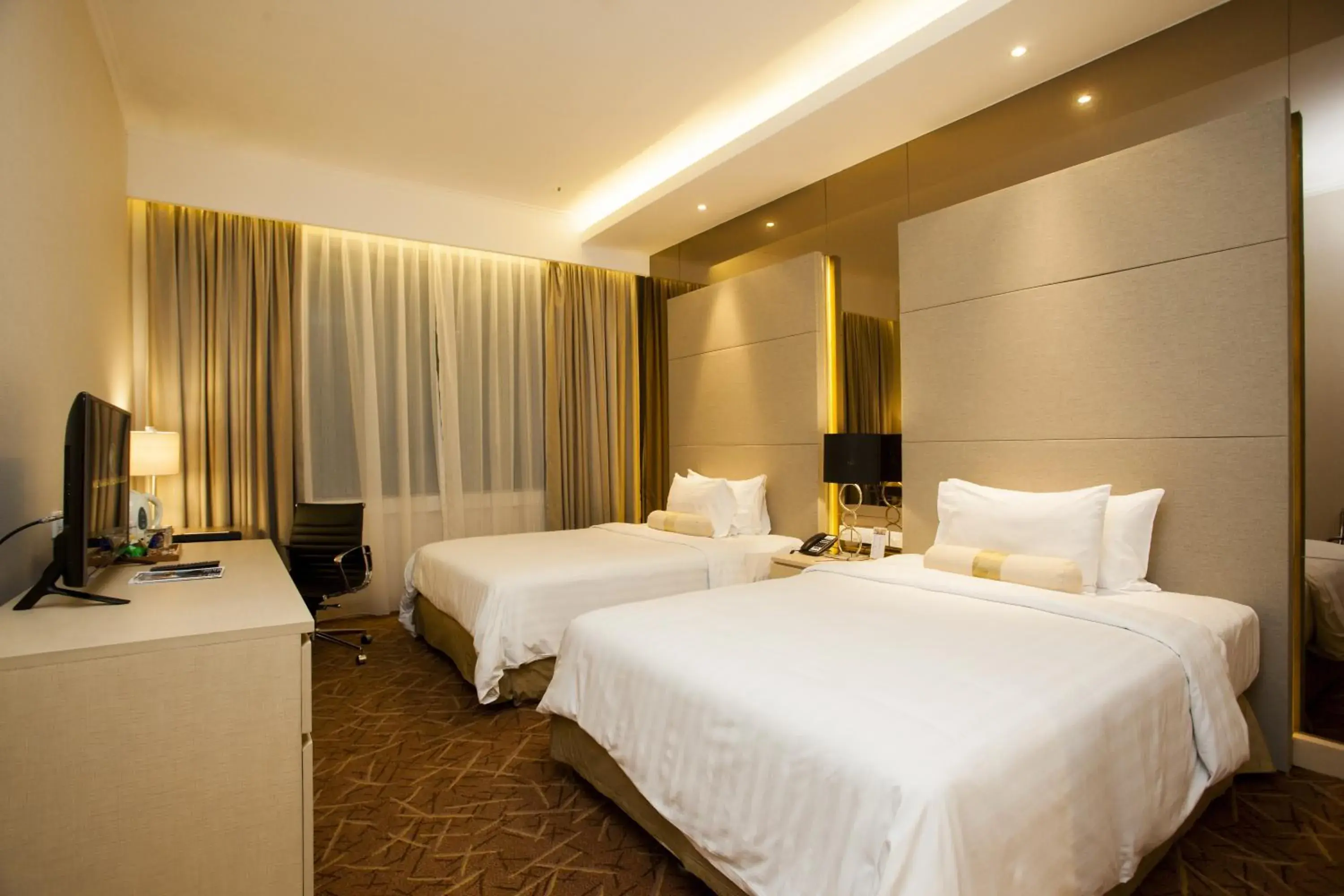 Bed in Menara Peninsula Hotel