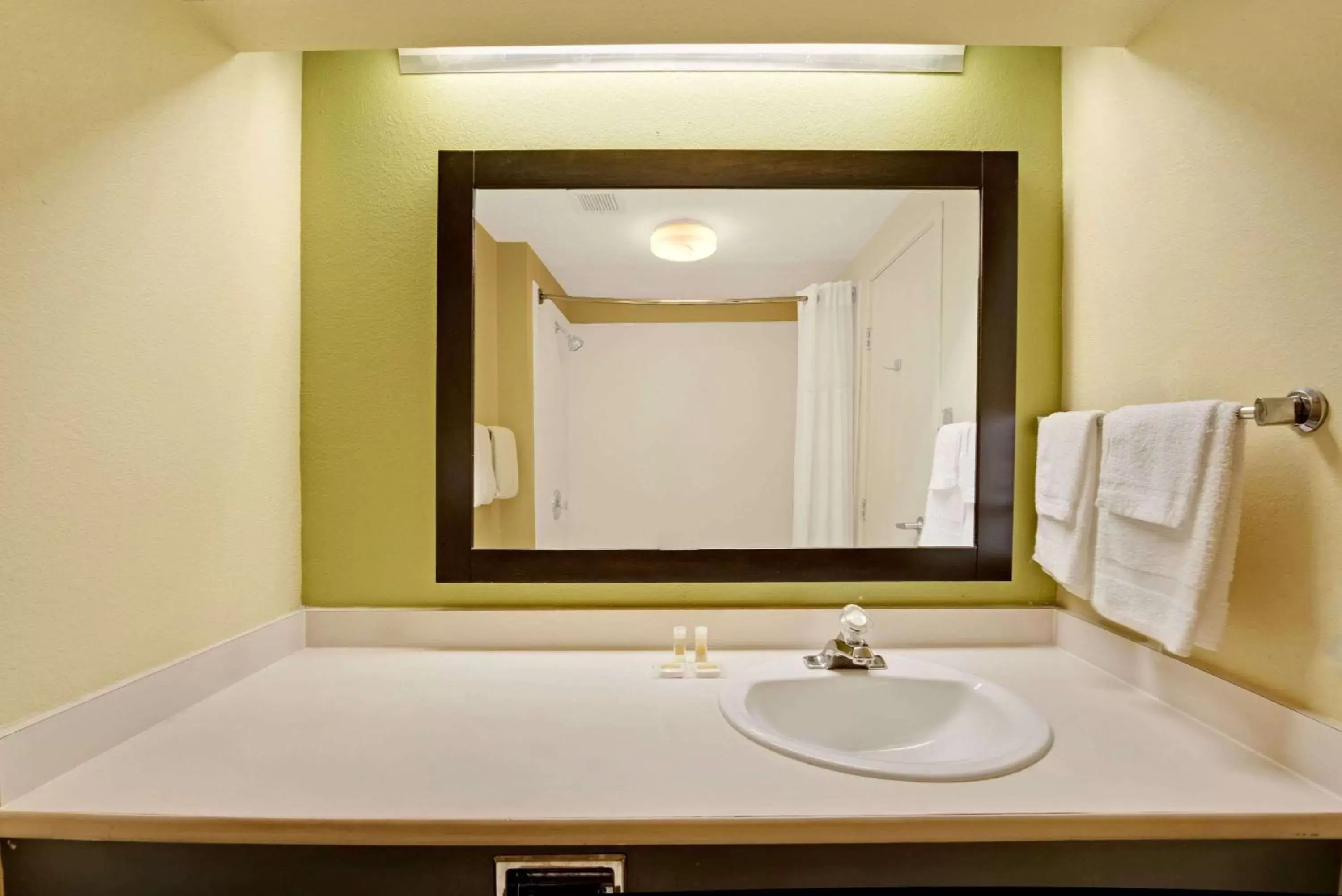 Bathroom in Days Inn & Suites by Wyndham DeSoto
