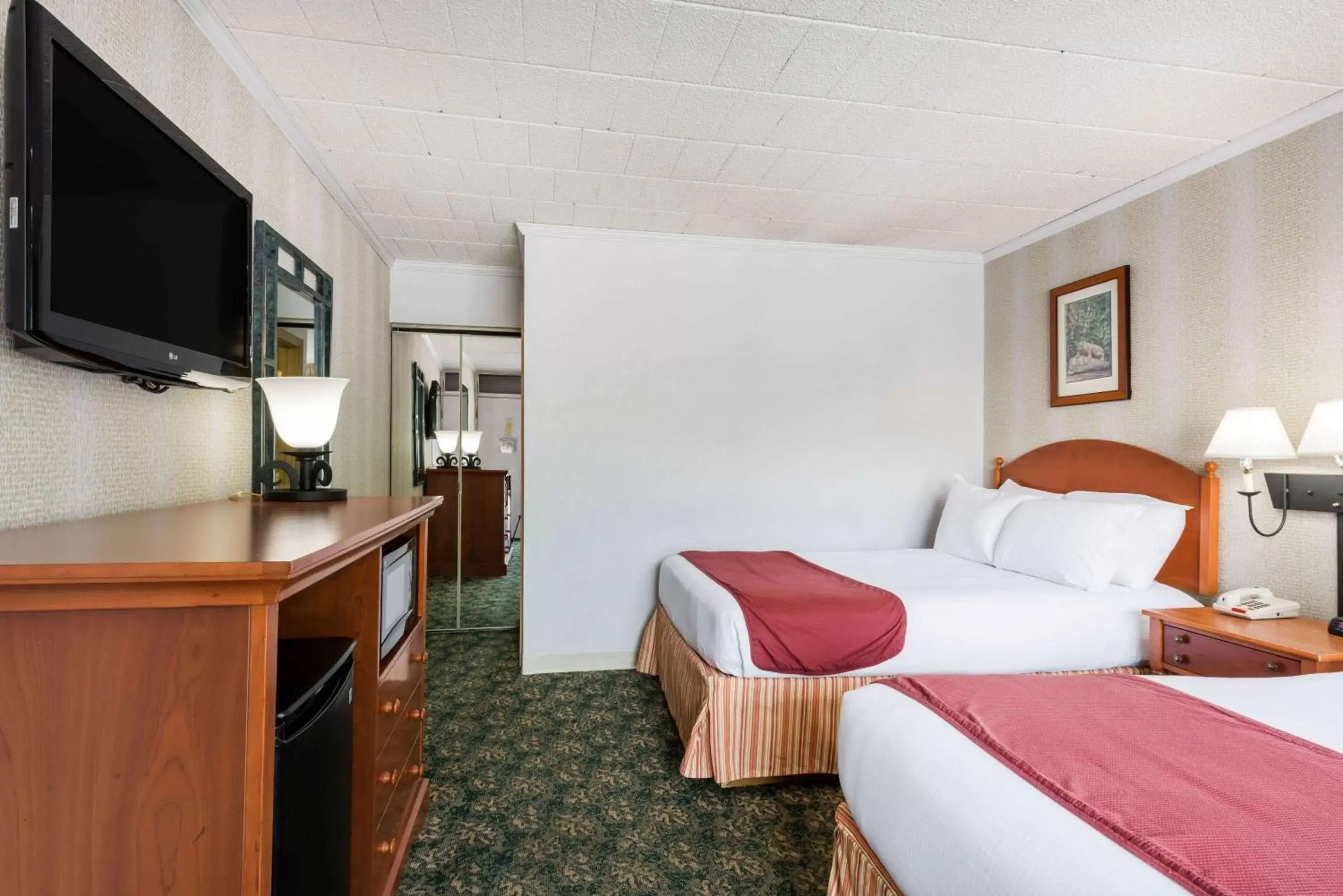 Photo of the whole room, Bed in Ramada by Wyndham State College Hotel & Conference Center