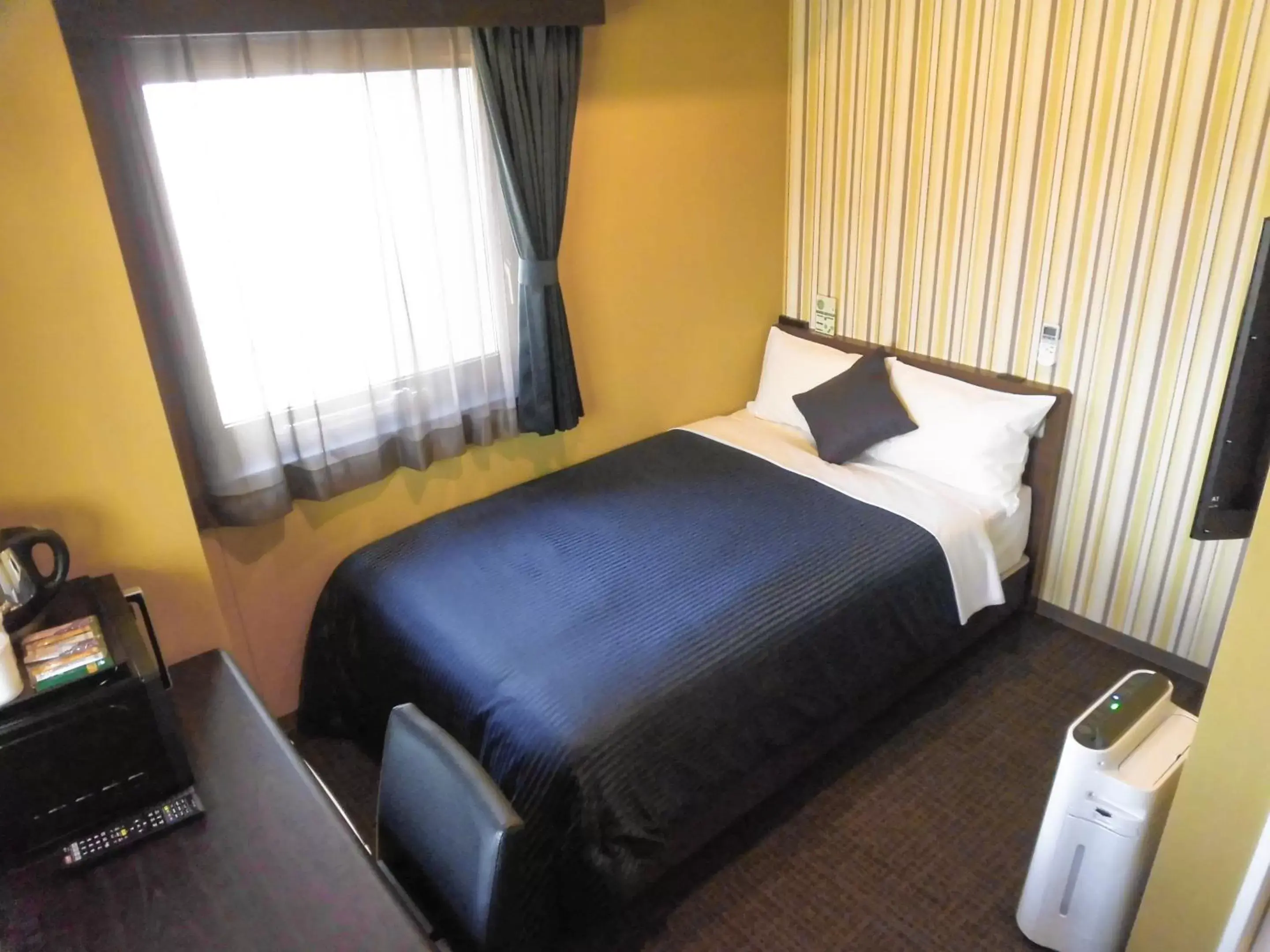 Bed in HOTEL LiVEMAX Fukuyama Ekimae
