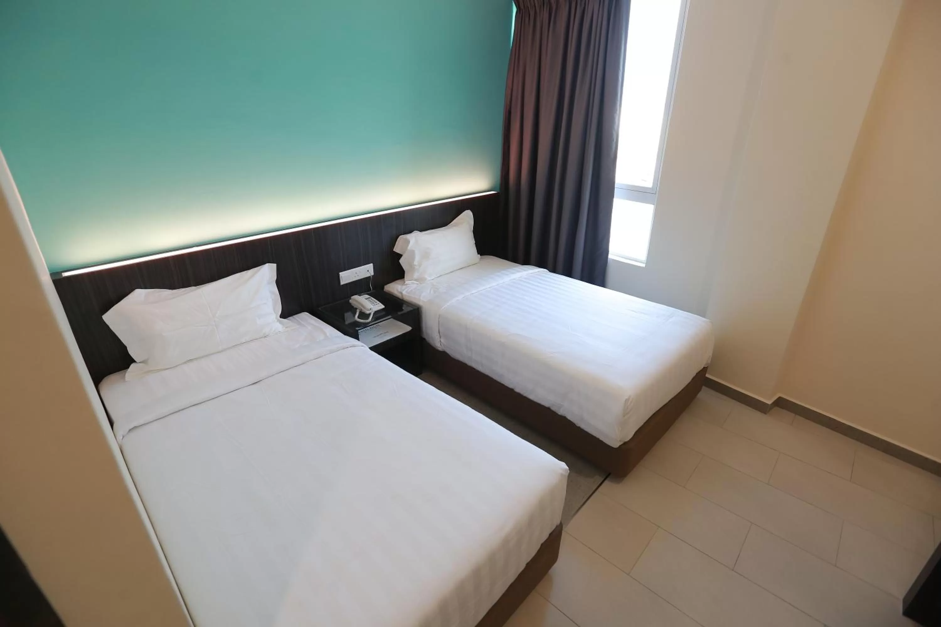 Bed in Pantai Regal Boutique Hotel