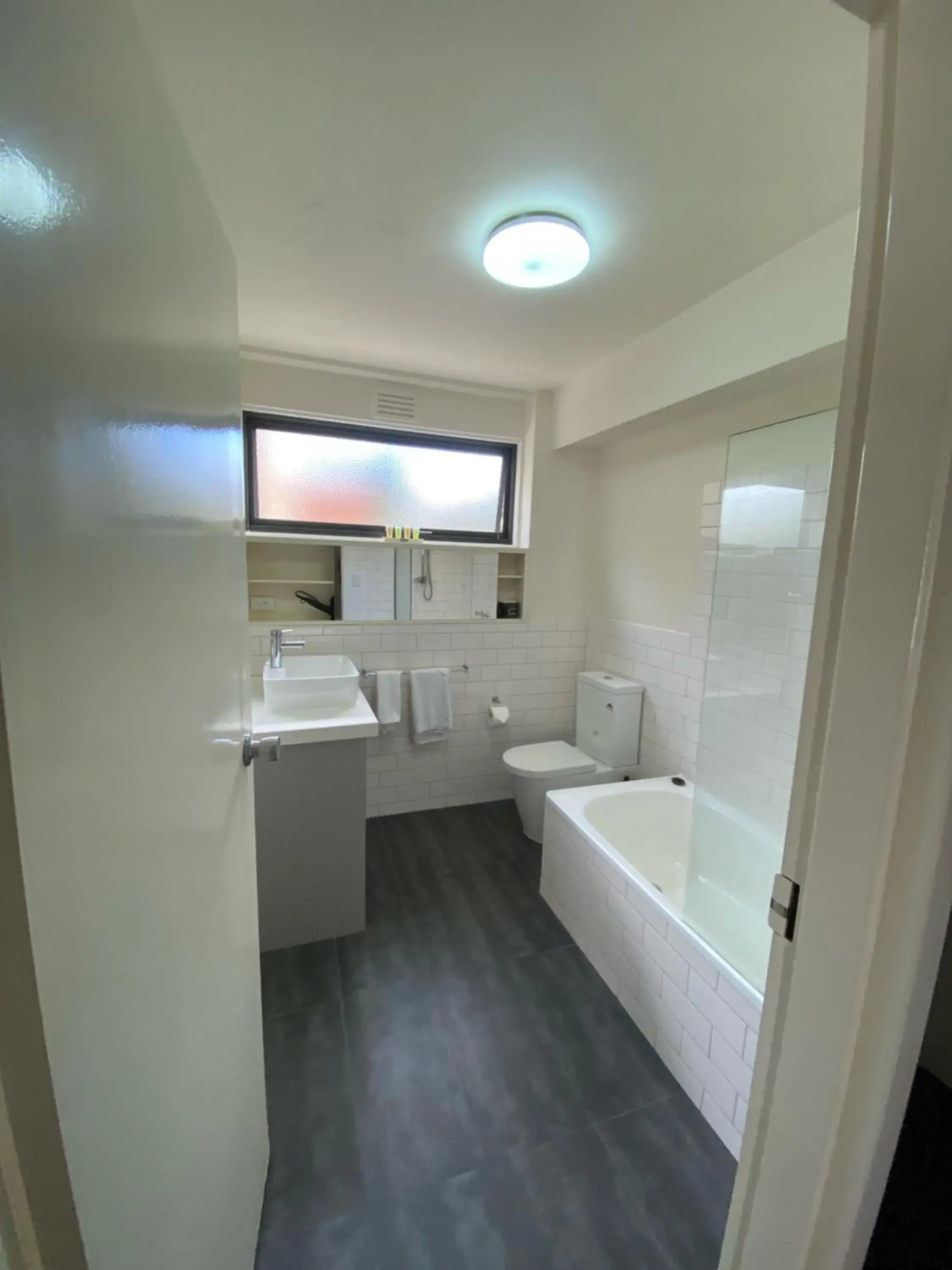 Bathroom in City Edge East Melbourne Apartment Hotel