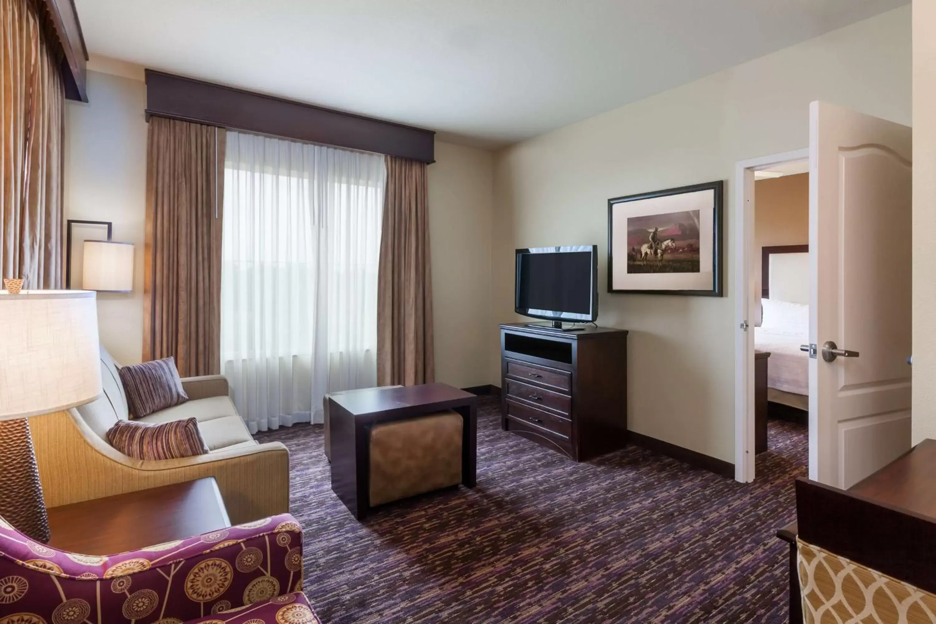 Bed, Seating Area in Homewood Suites Wichita Falls