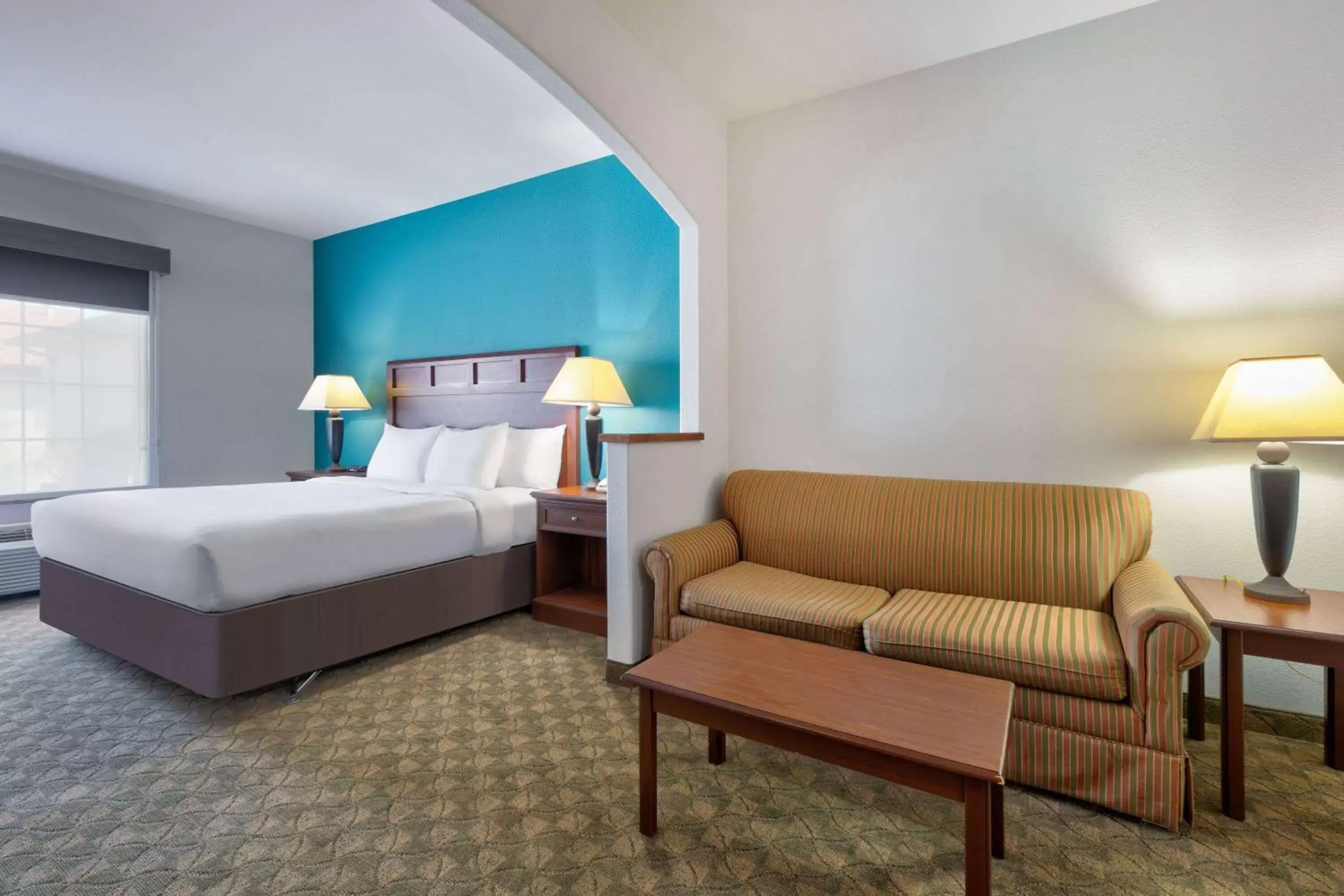 Bed in Baymont Inn & Suites by Wyndham Glen Rose