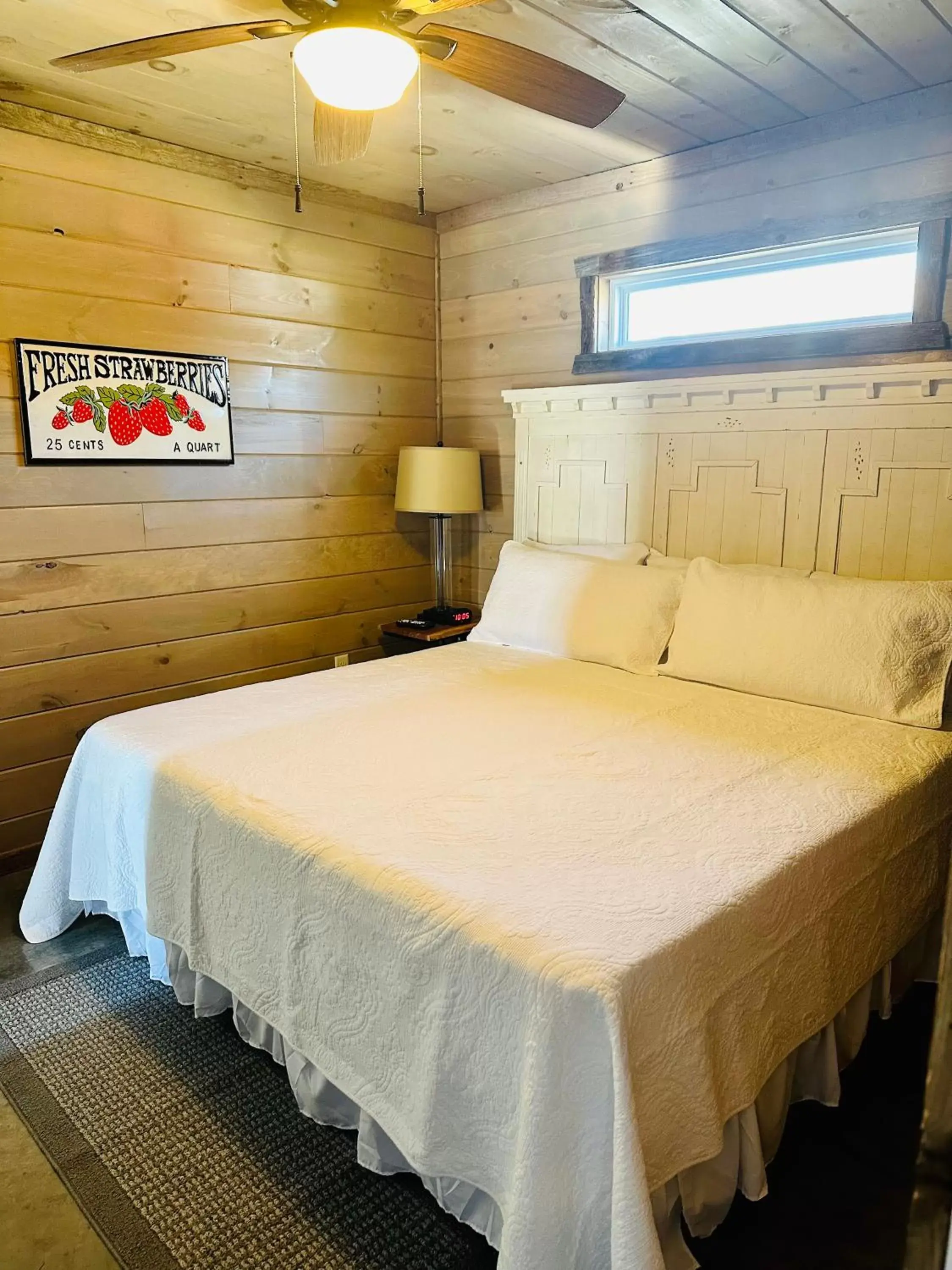 Bed in Knotty Squirrel Cabins