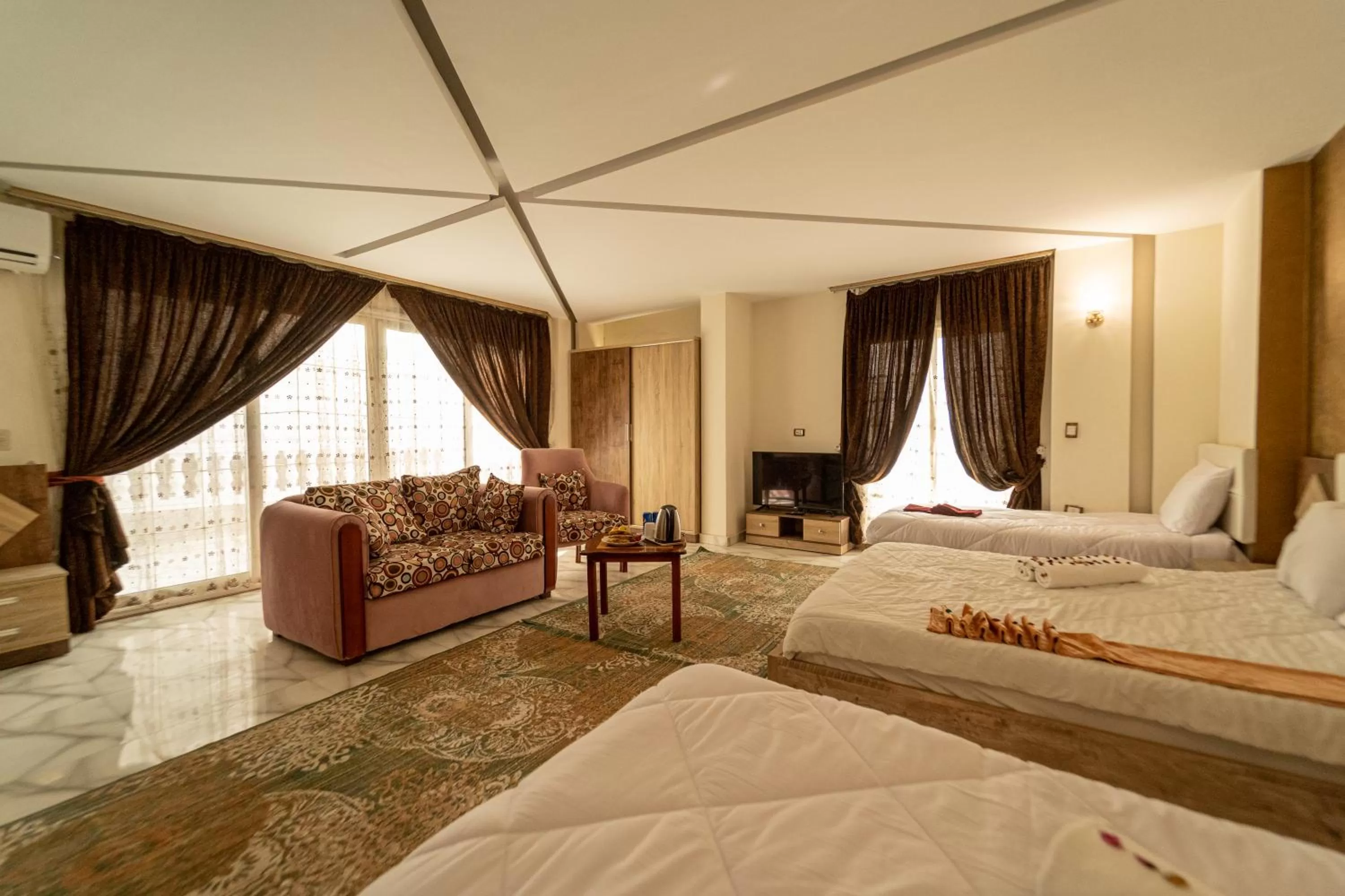 Photo of the whole room, Bed in Gardenia Inn Hotel