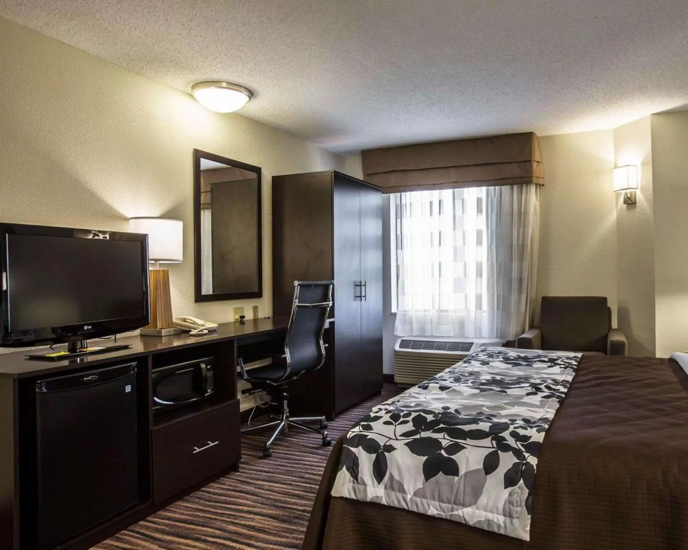 Photo of the whole room, TV/Entertainment Center in Sleep Inn Airport Greensboro