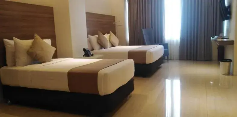 Bed in Eastland Hotel And Residences