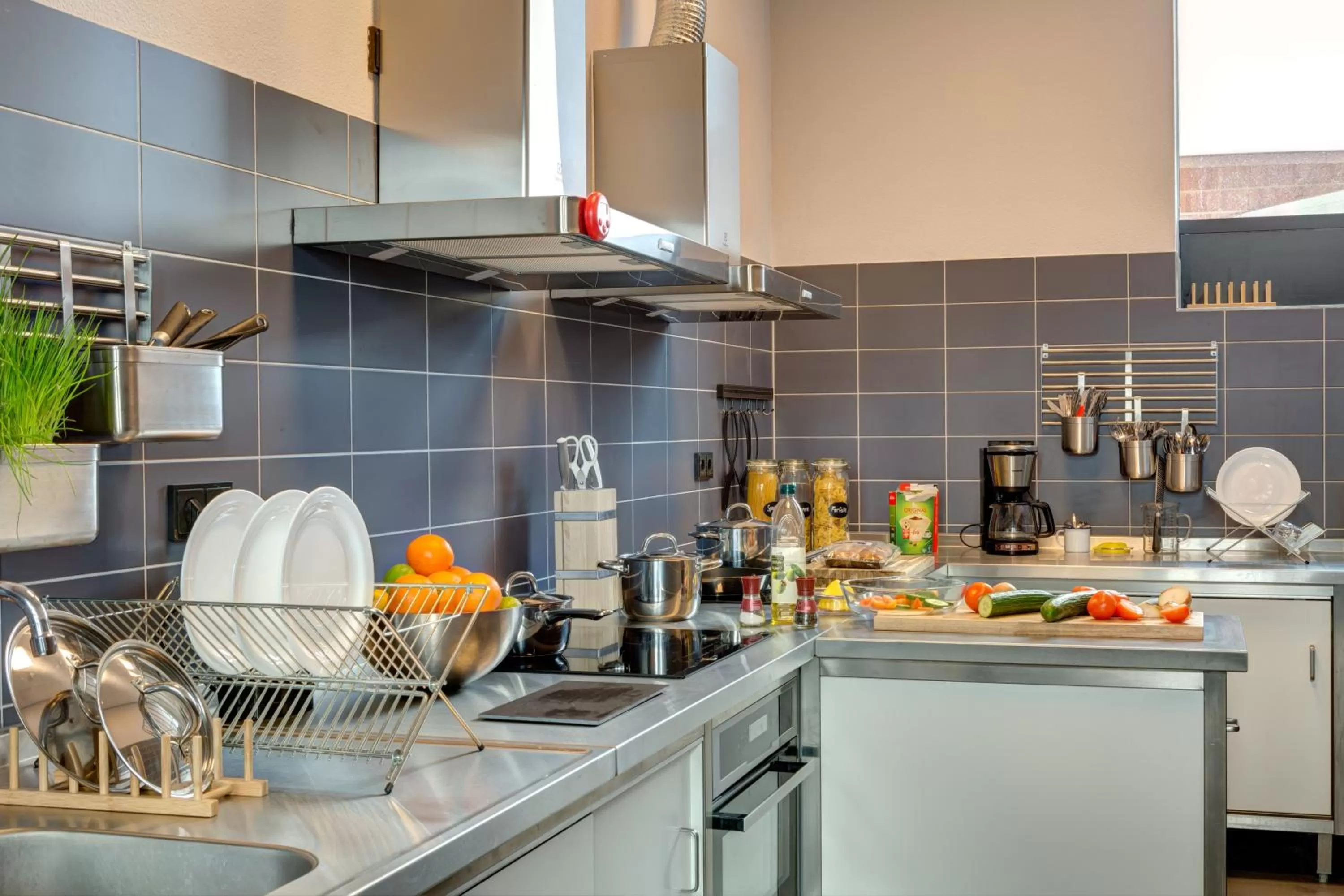 Communal kitchen in MEININGER Hotel Amsterdam Amstel