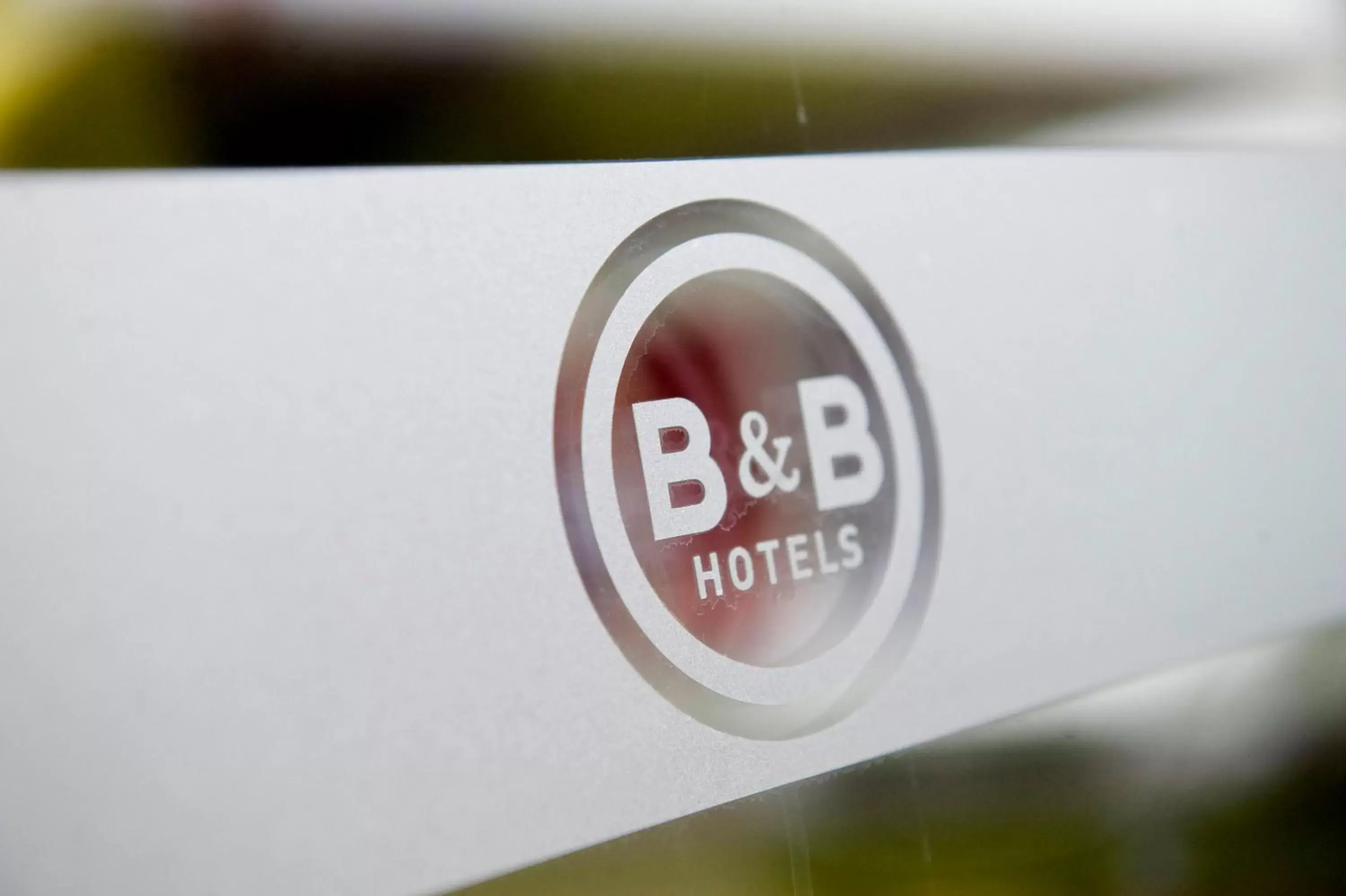 Property logo or sign in B&B HOTEL Lyon Grand Stade Meyzieu