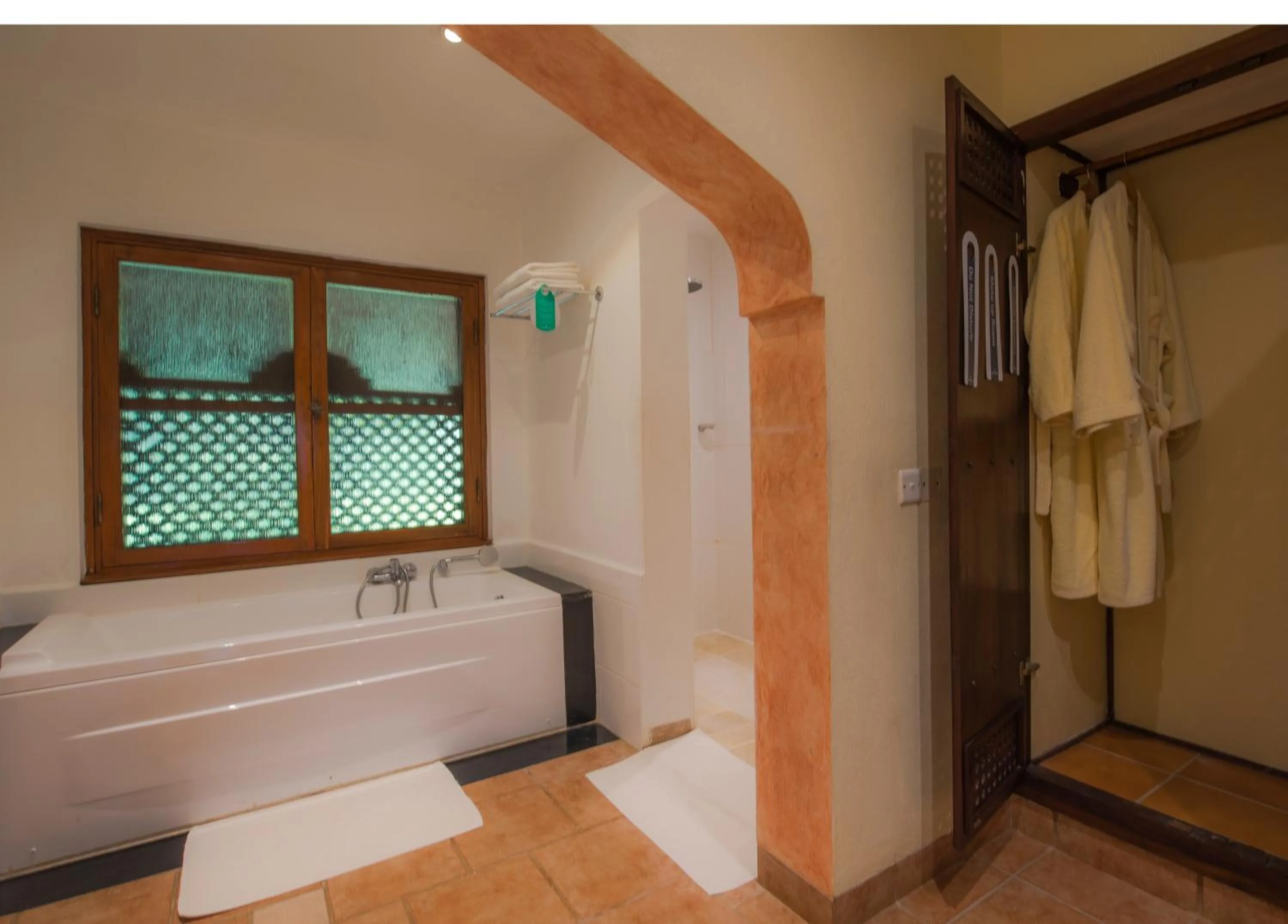 Bathroom, Bed in Amani Beach Resort