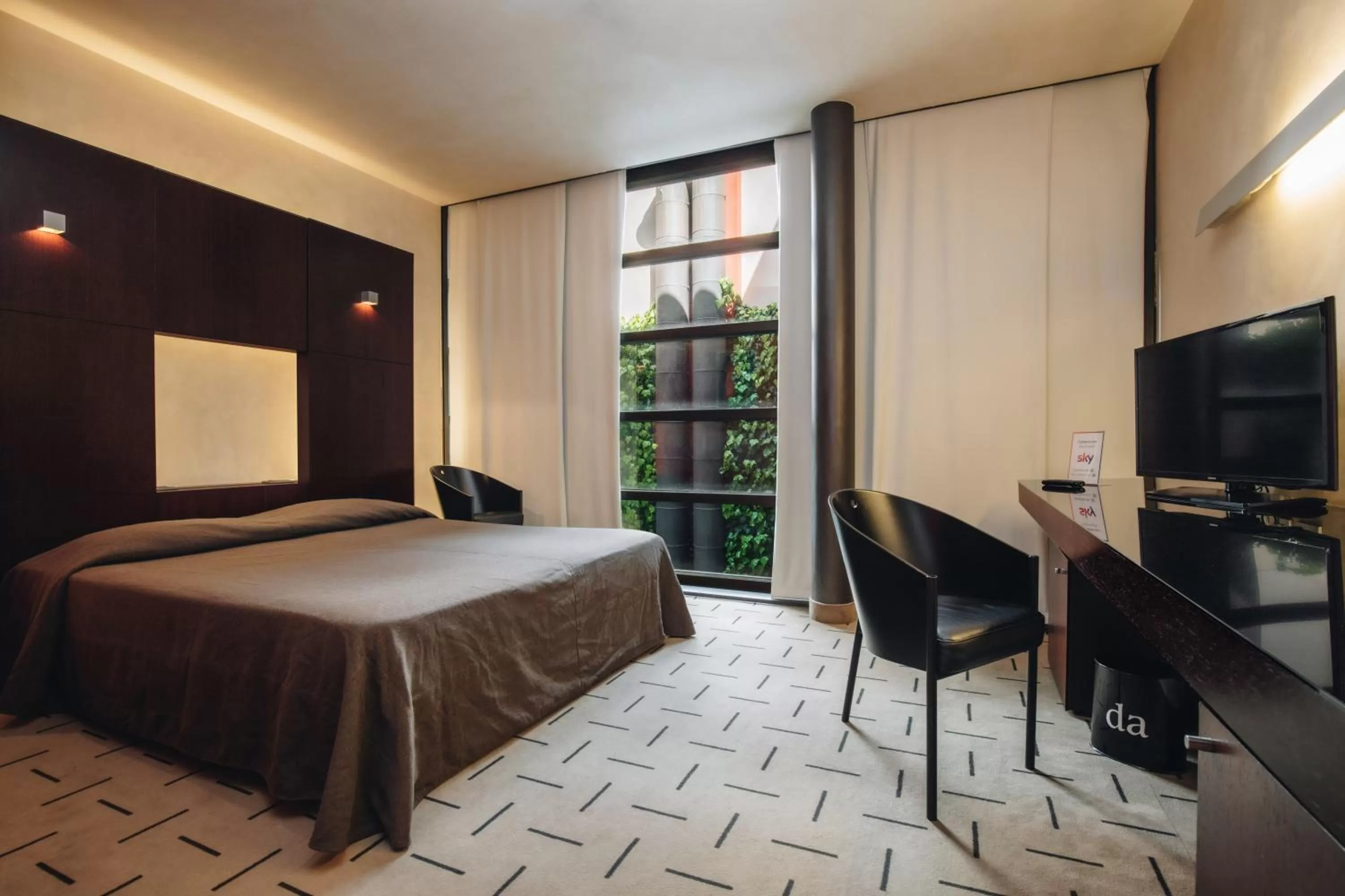 Bed in DelleArti Design Hotel