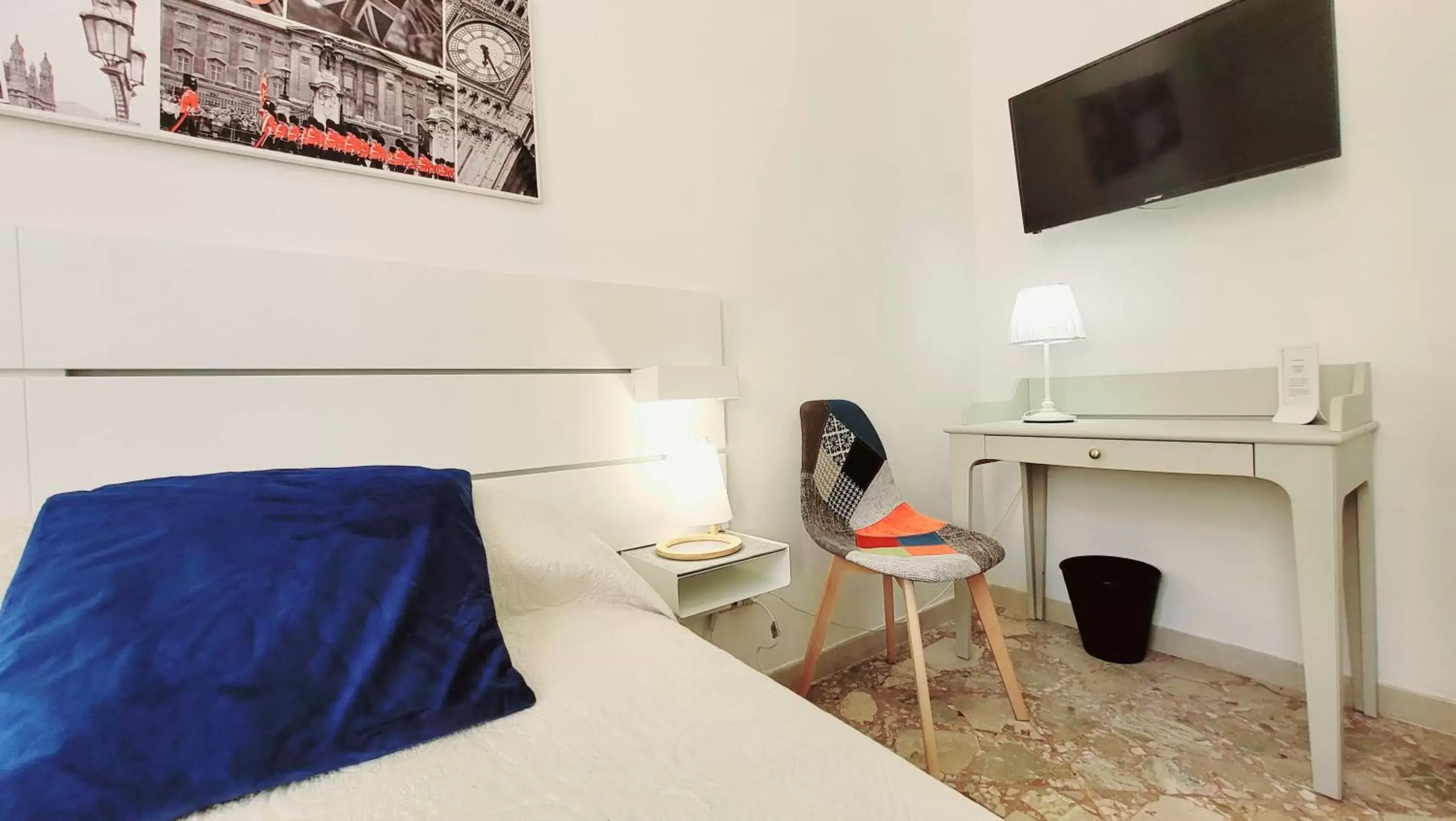 Bed, TV/Entertainment Center in Zanzi 's Charming Rooms