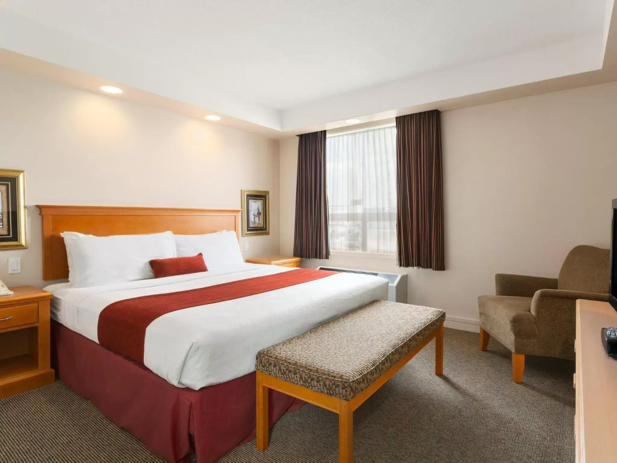 One-Bedroom Suite with One King Bed and One Queen Bed- Non-Smoking in Travelodge by Wyndham Spruce Grove