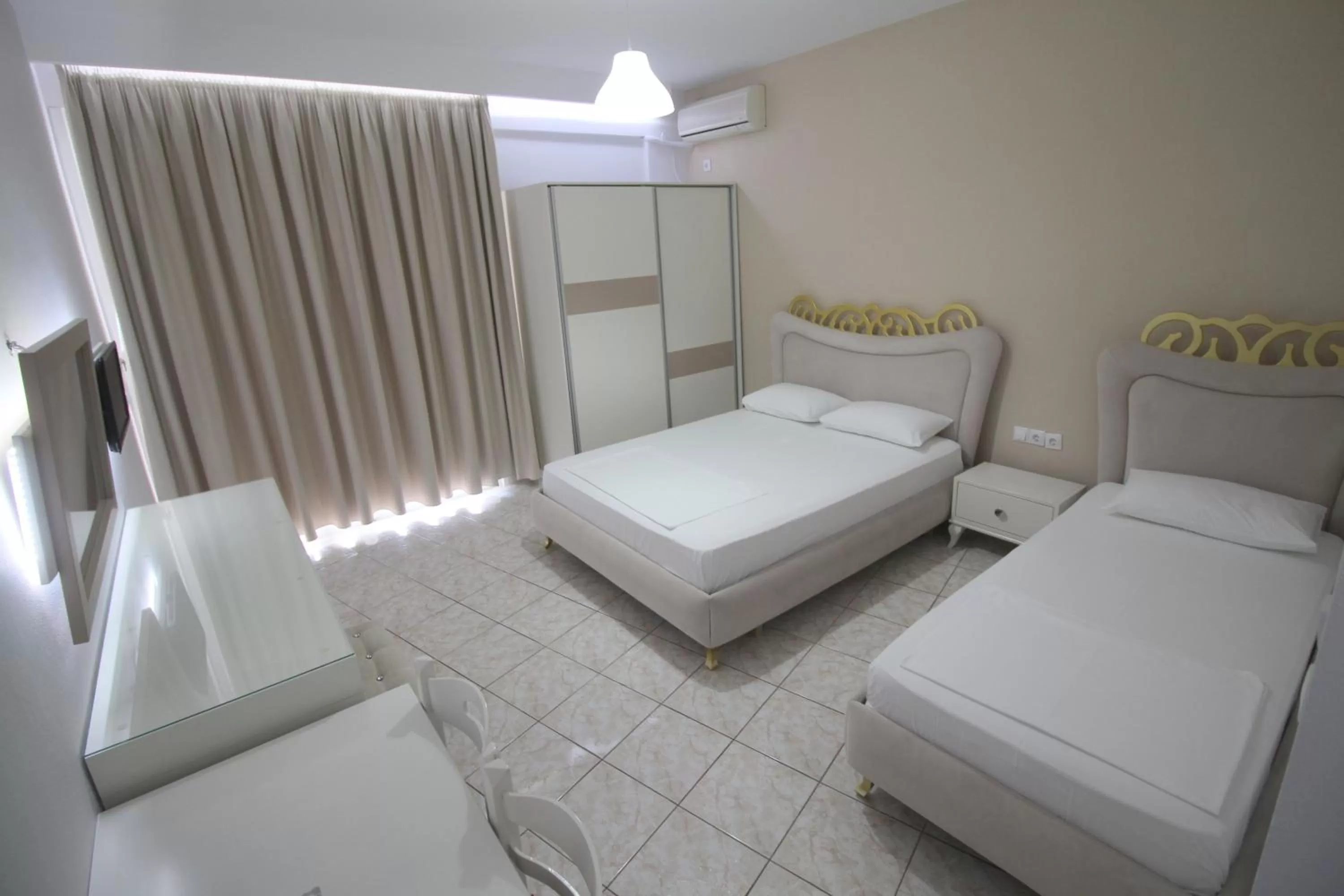 Bed in Murati Suites Sarandë