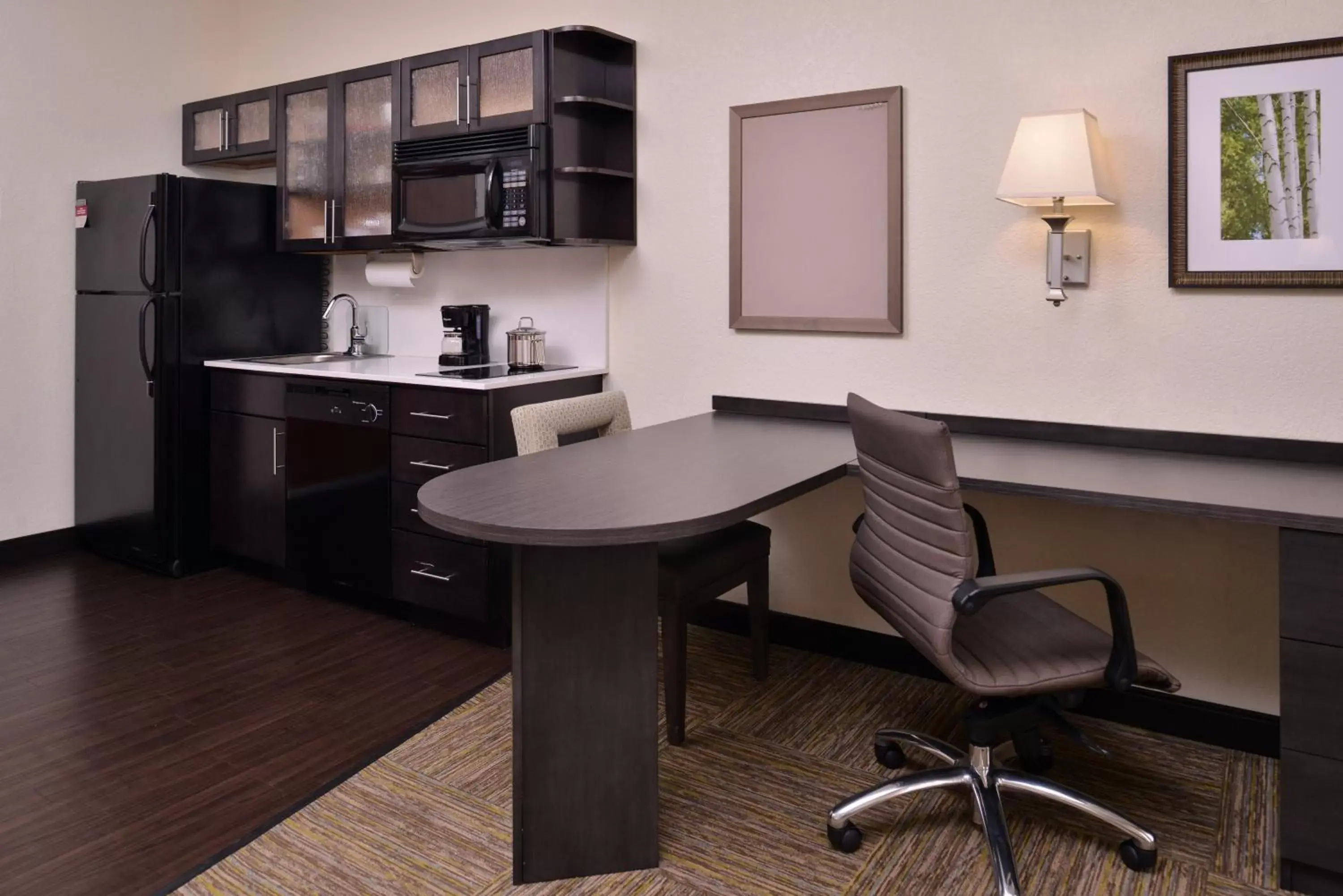 Photo of the whole room, Kitchen/Kitchenette in Candlewood Suites Terre Haute, an IHG Hotel