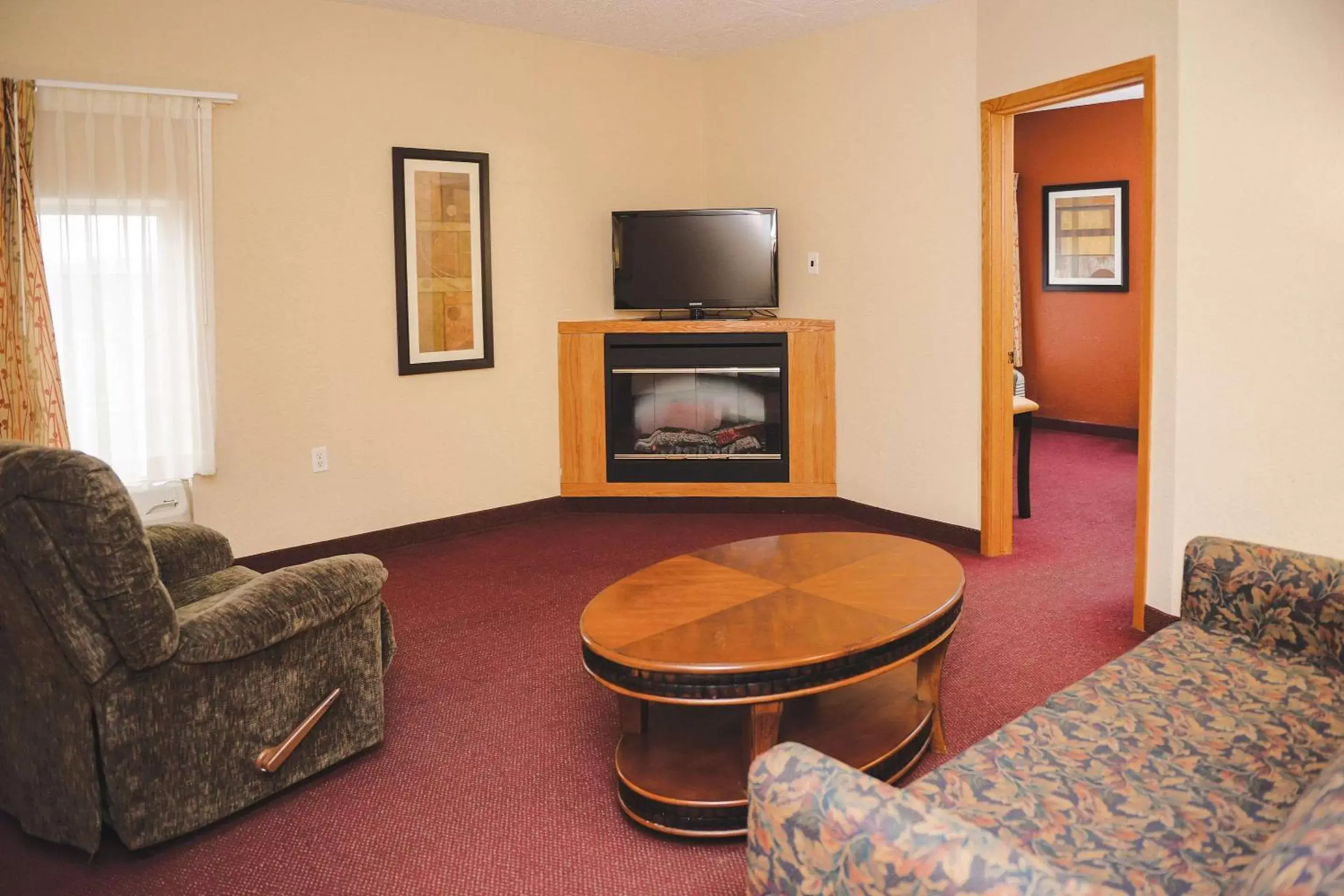 Photo of the whole room, TV/Entertainment Center in Quality Inn & Suites Ames Conference Center Near ISU Campus
