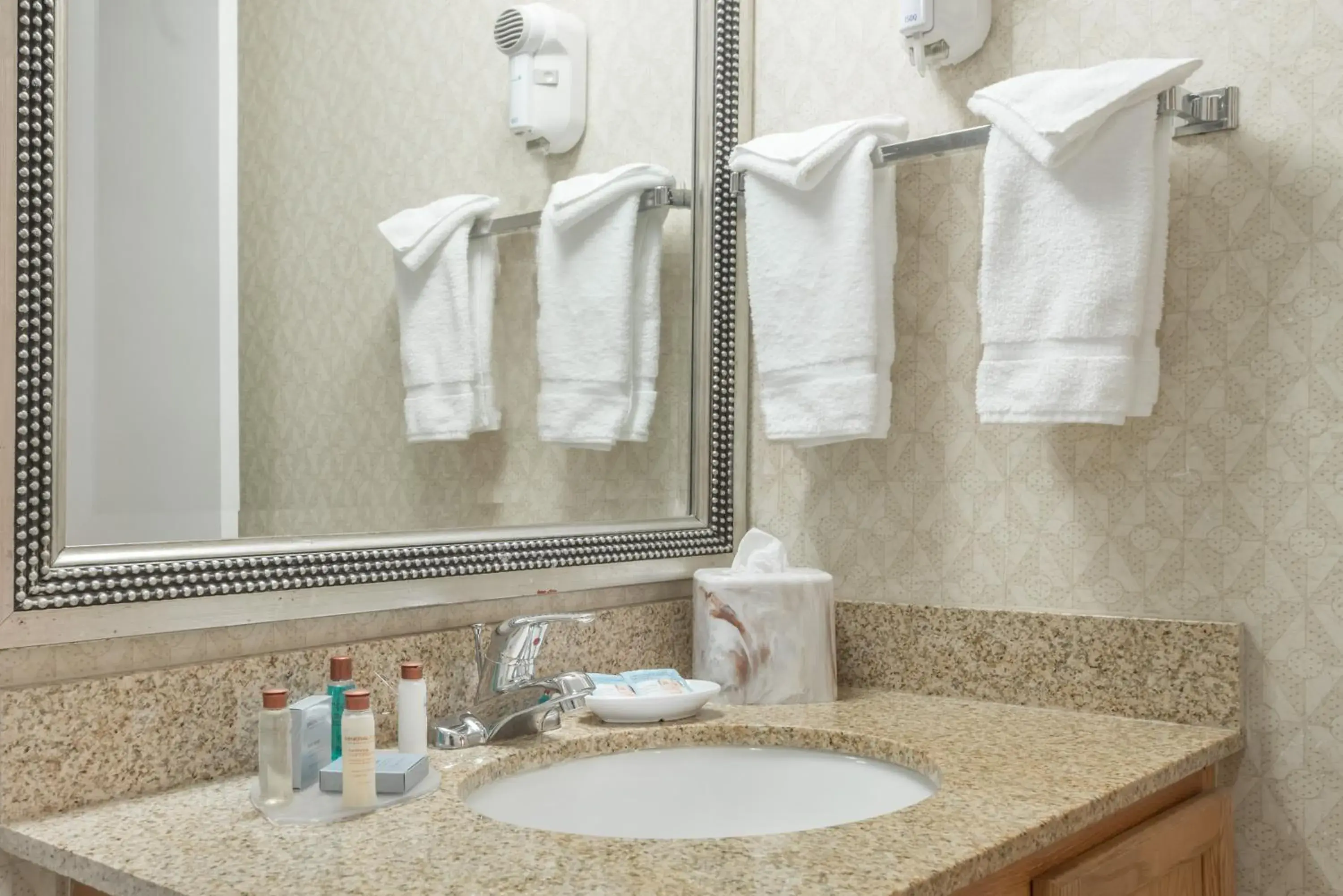 Shower, Bathroom in Craigshire Suites St Louis Westport Plaza