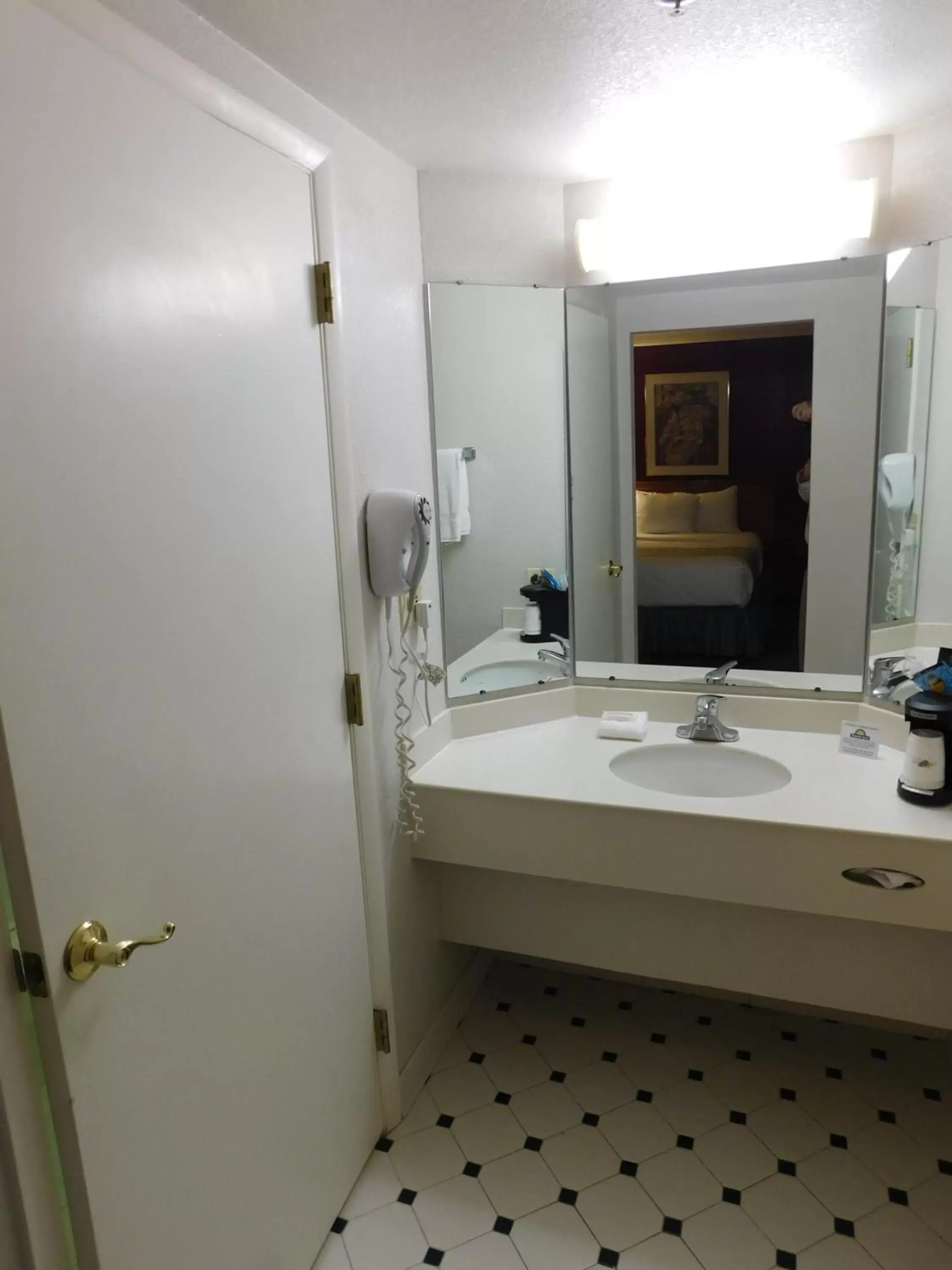 Bathroom in Days Inn & Suites by Wyndham Arlington Heights