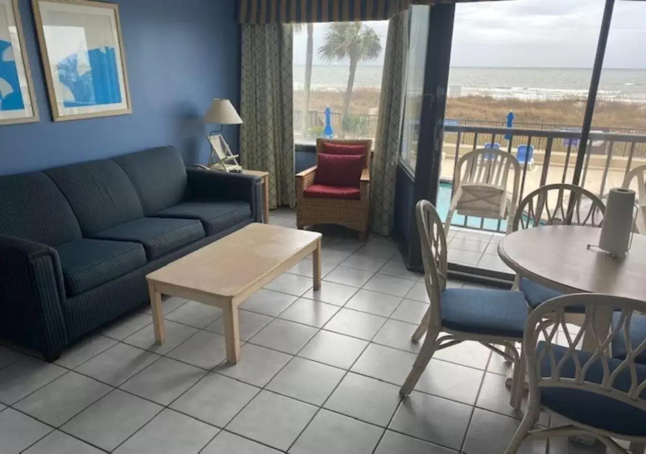 Living room, Seating Area in Ocean Club Resort Myrtle Beach a Ramada by Wyndham