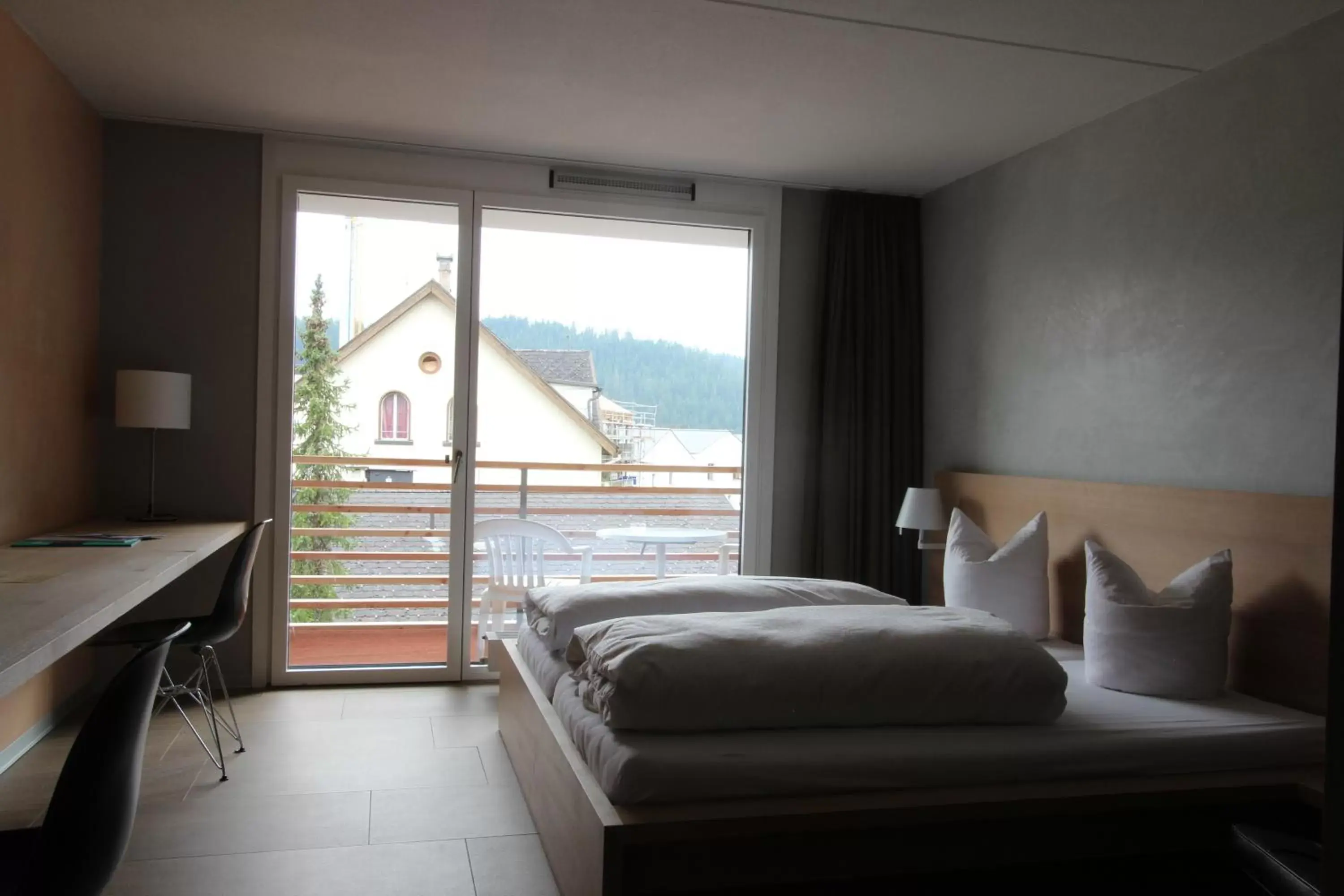 Bedroom in Hotel des Alpes