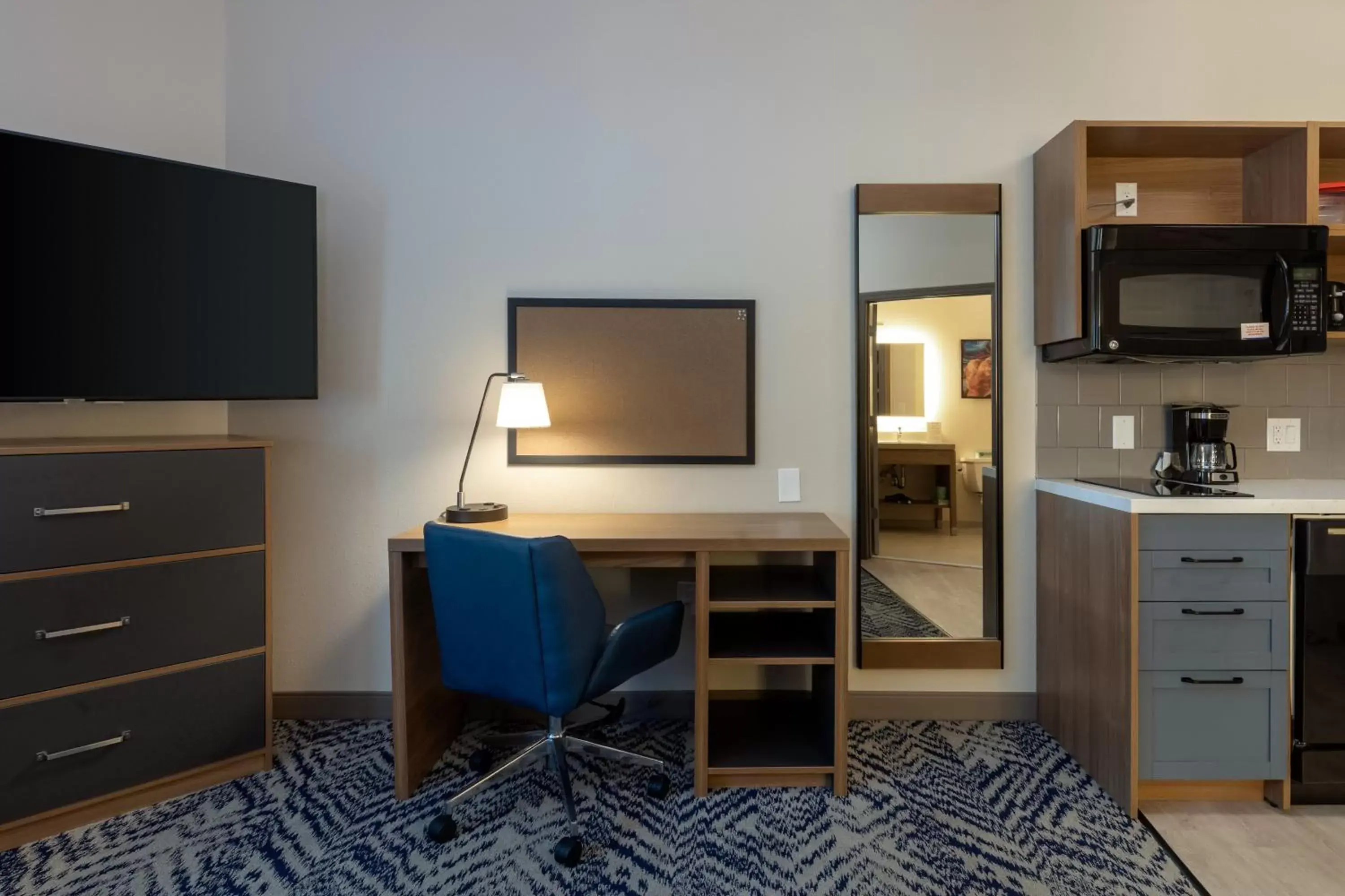Photo of the whole room, TV/Entertainment Center in Candlewood Suites Enterprise, an IHG Hotel