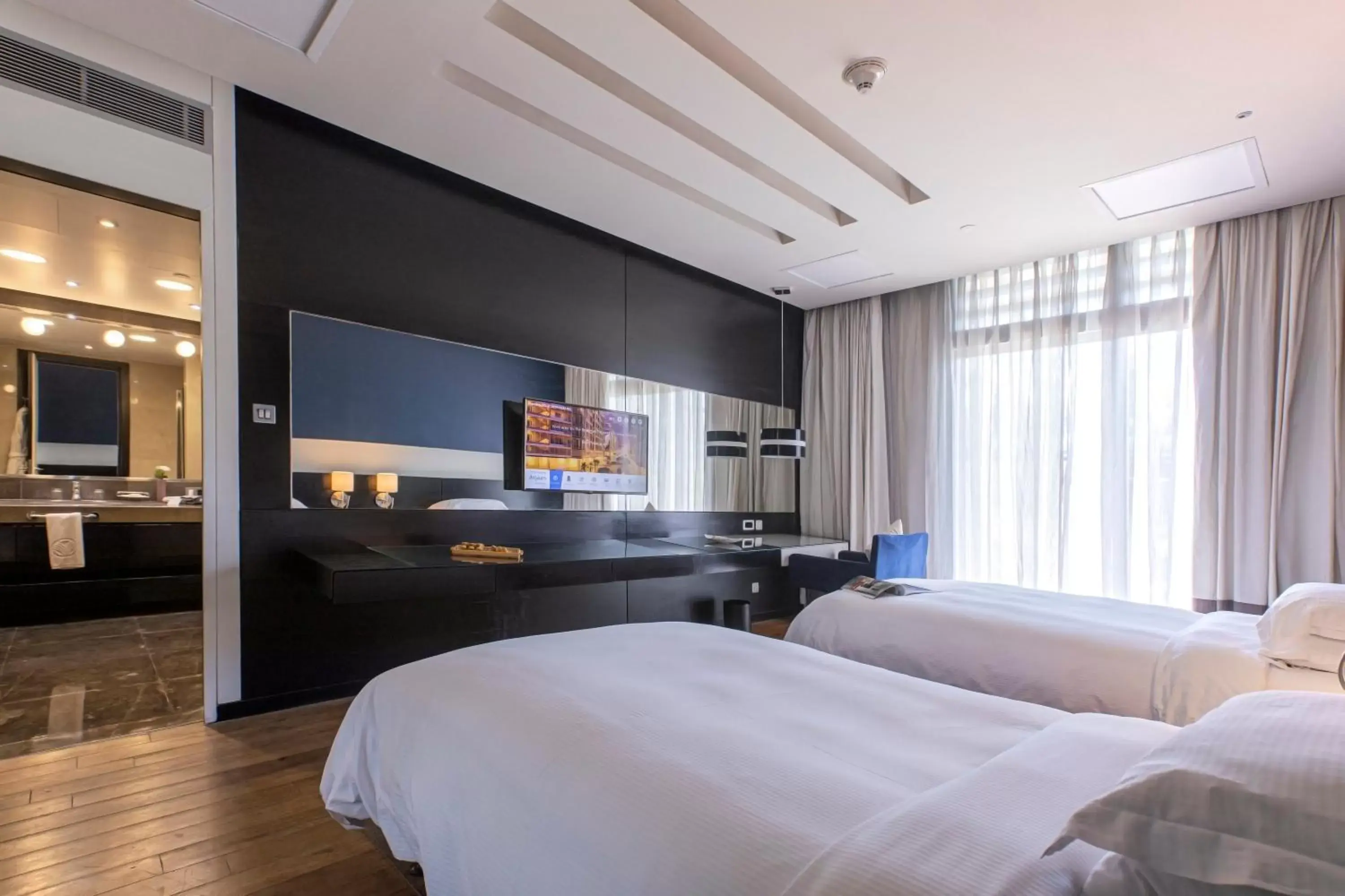 Bedroom, TV/Entertainment Center in The Boulevard Arjaan by Rotana