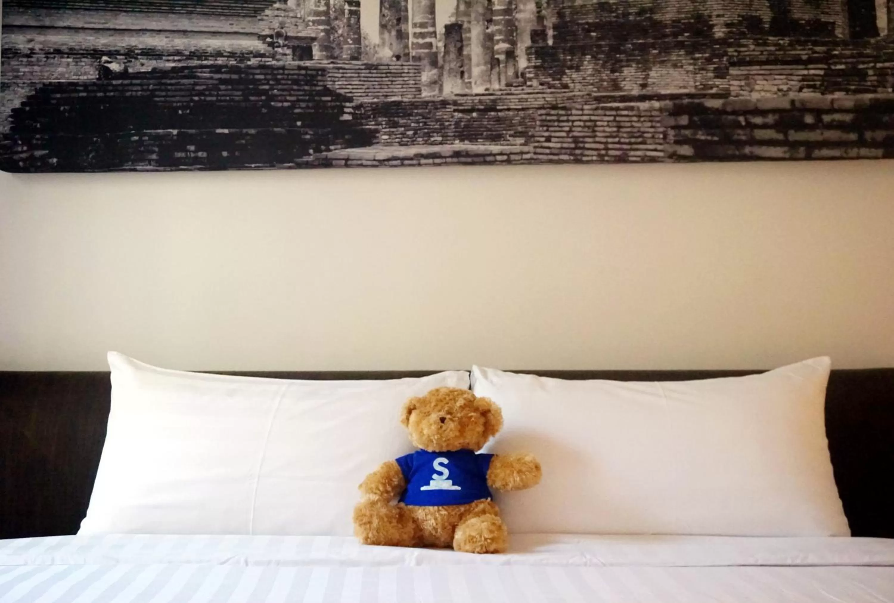 Bed in S33 Compact Sukhumvit Hotel