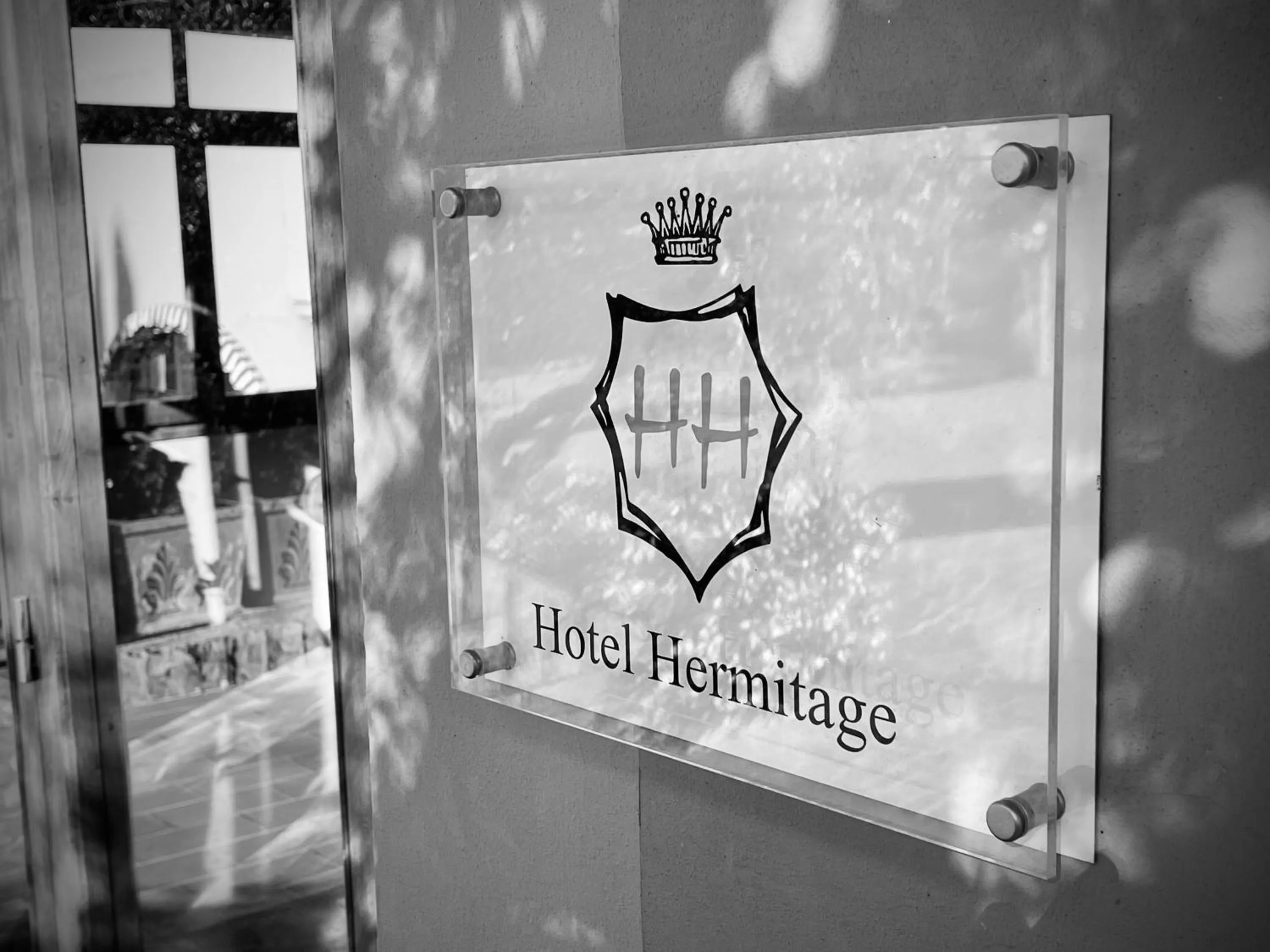 Property logo or sign in Hotel Hermitage