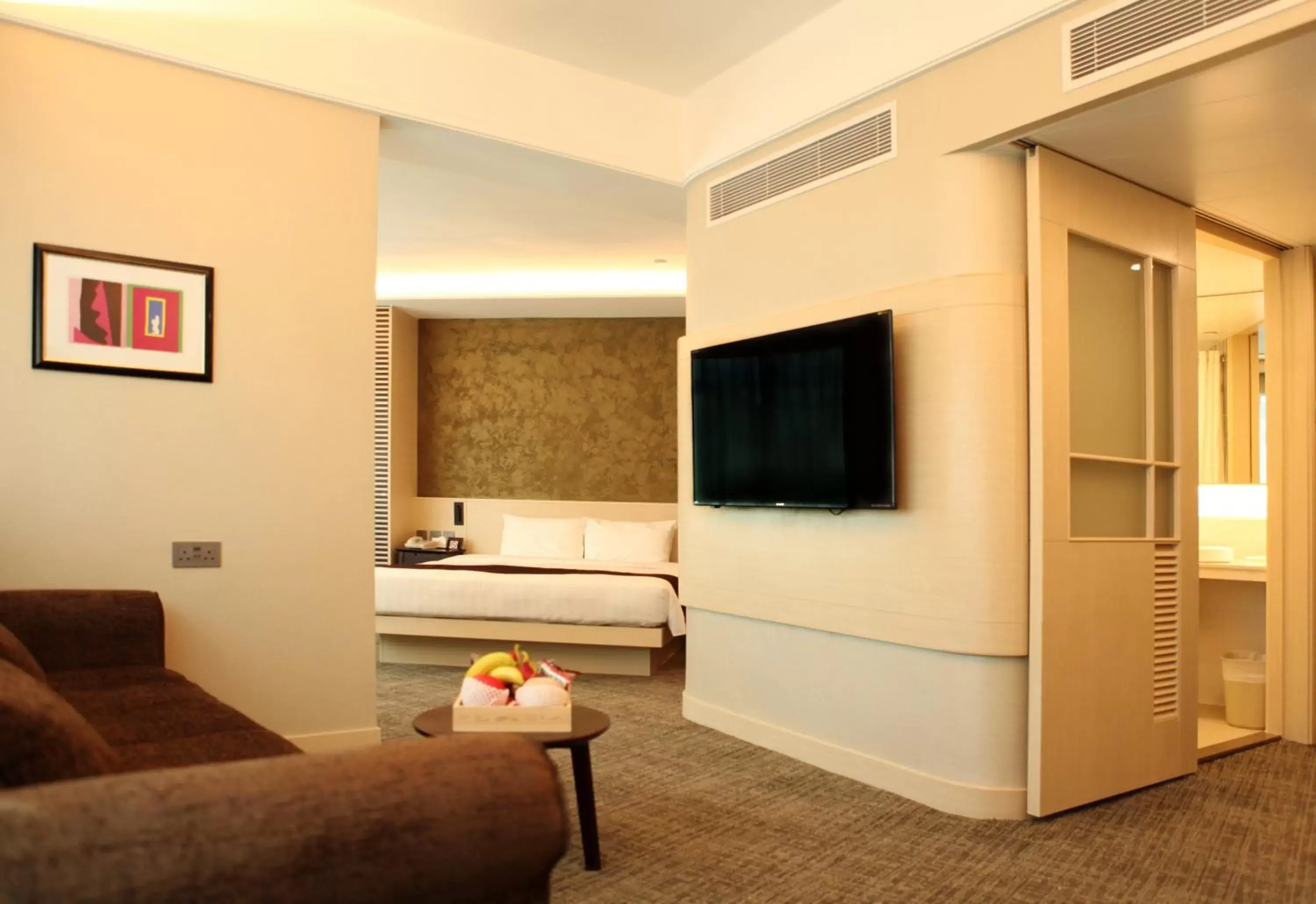 Bed, TV/Entertainment Center in South Pacific Hotel