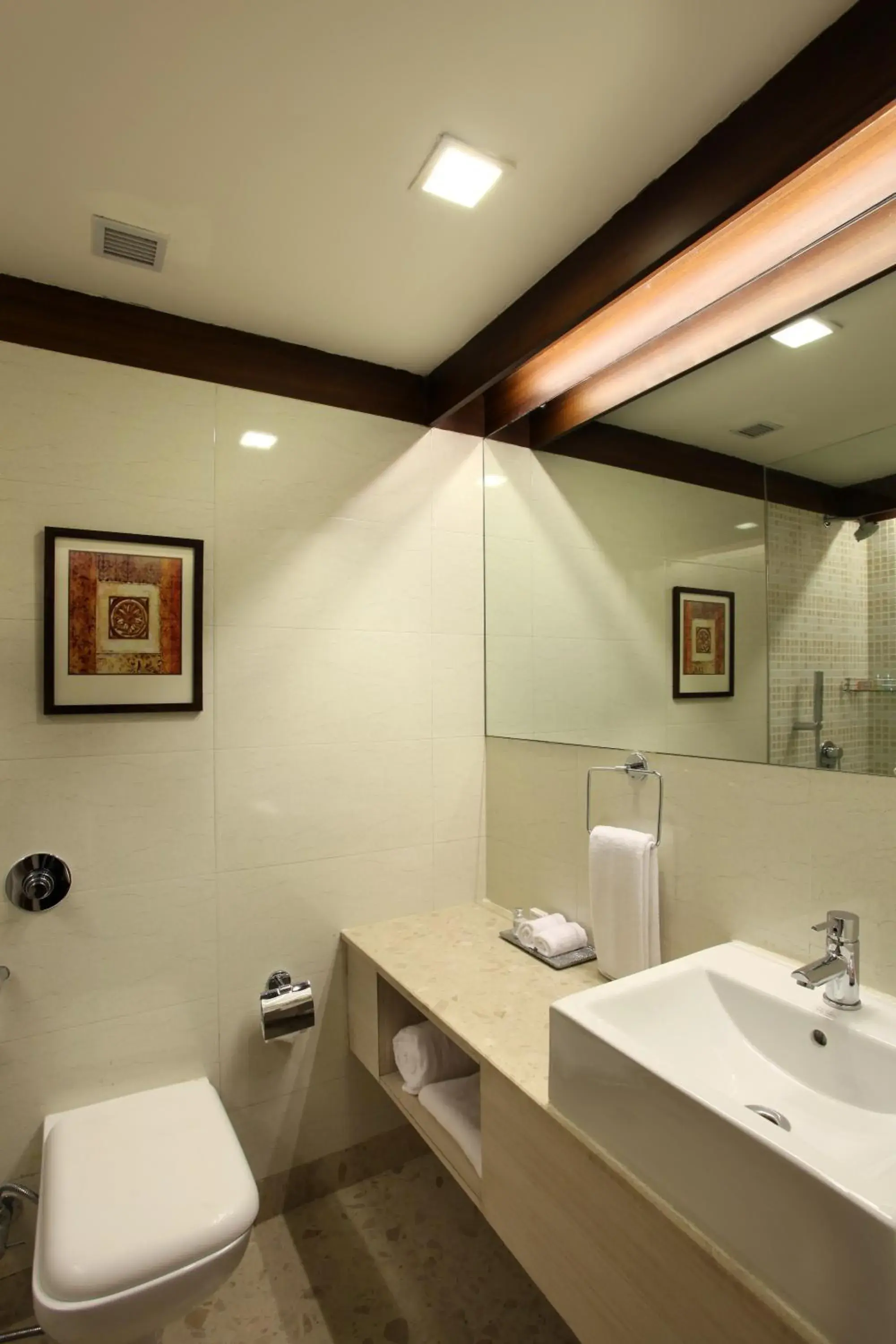 Toilet, Bathroom in Mahagun Sarovar Portico Suites Ghaziabad