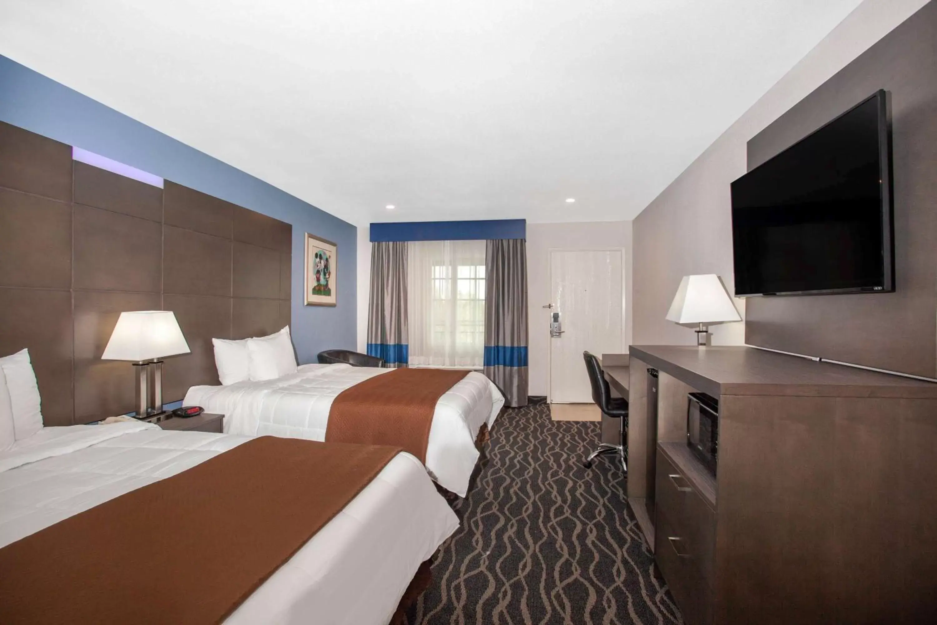 Photo of the whole room, TV/Entertainment Center in Travelodge Inn & Suites by Wyndham Anaheim on Disneyland Dr