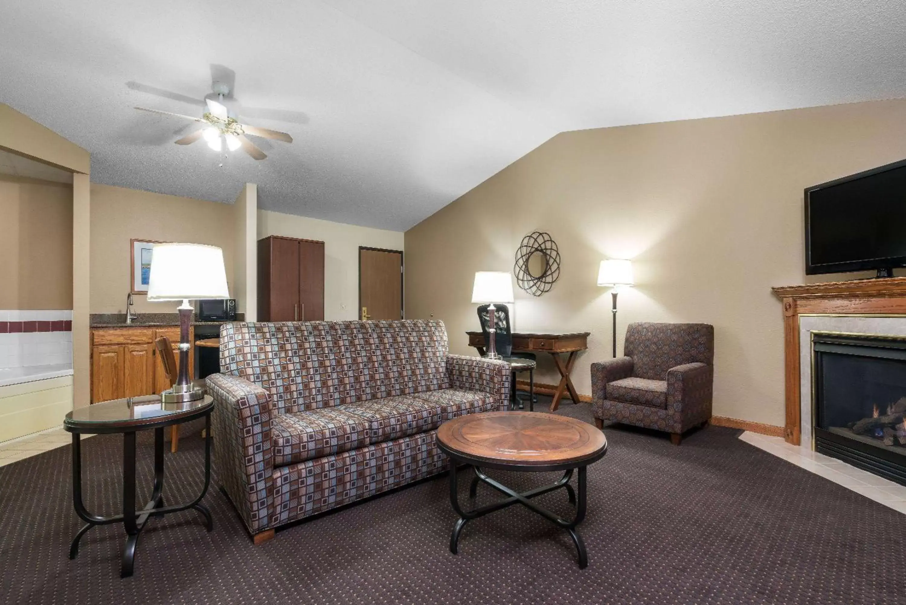 Photo of the whole room, Seating Area in AmericInn by Wyndham Lake City